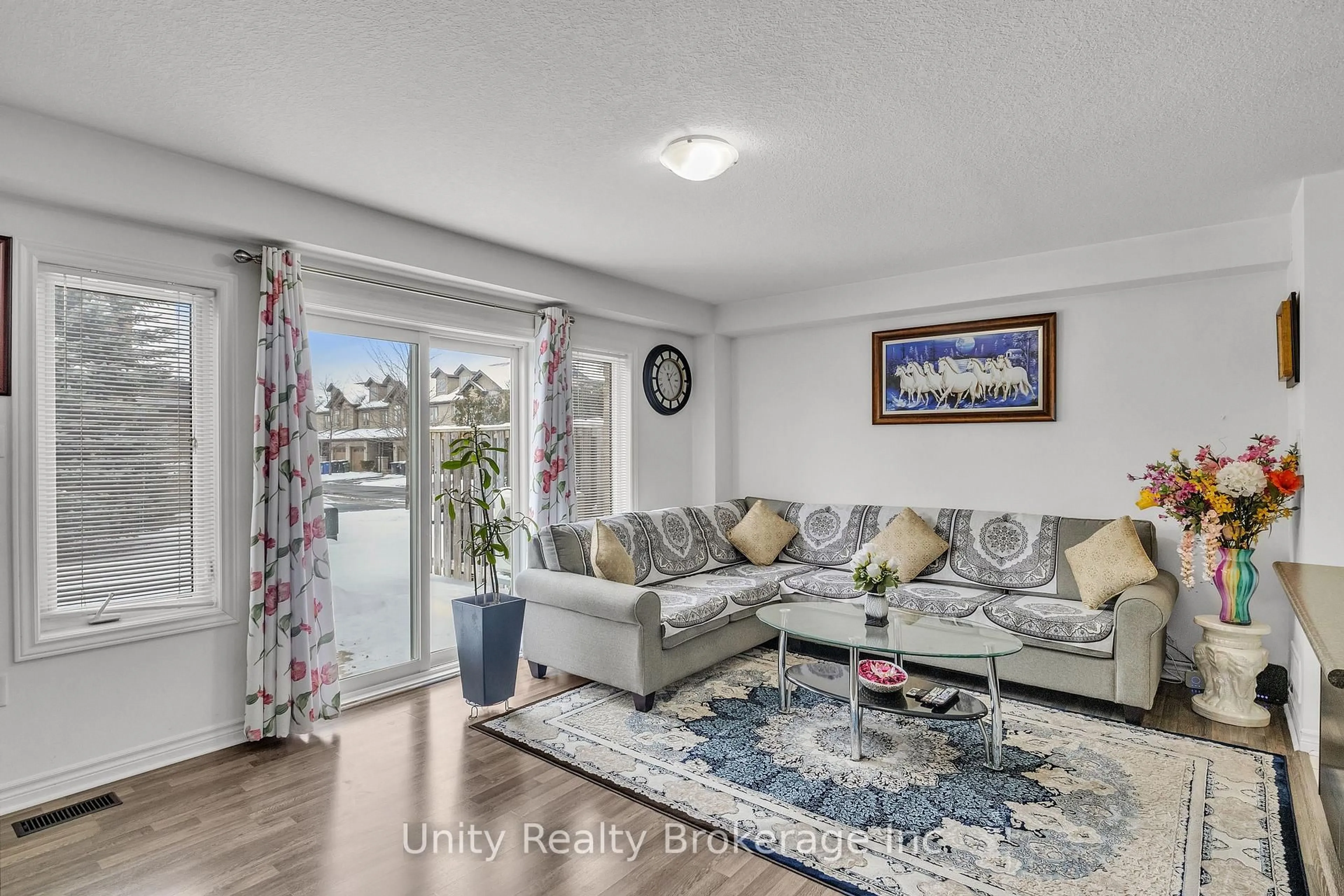 Living room with furniture, wood/laminate floor for 44 Arlington Cres, Guelph Ontario N1L 0K9