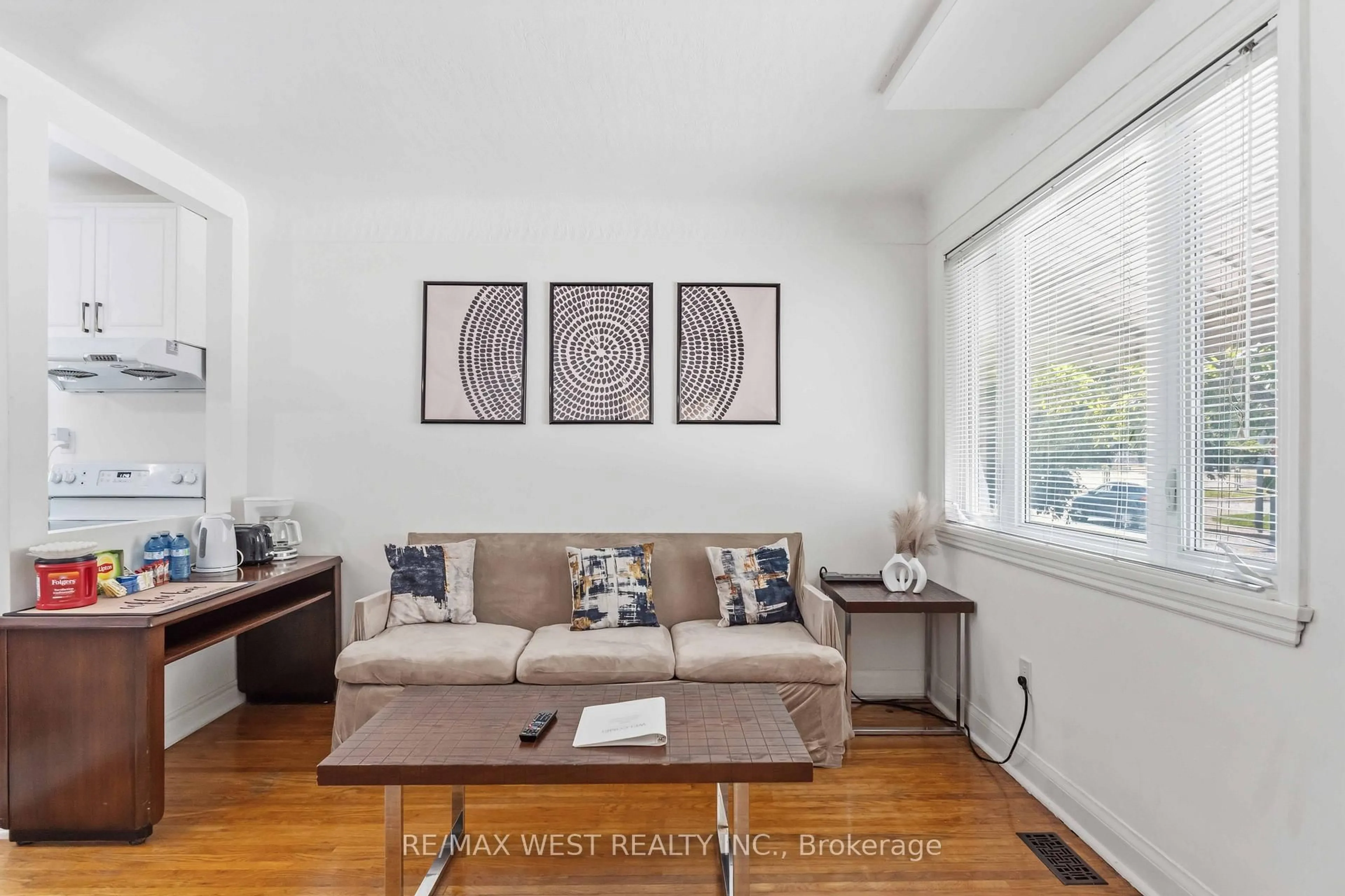 Living room with furniture, wood/laminate floor for 5177 Kitchener St, Niagara Falls Ontario L2G 1B4