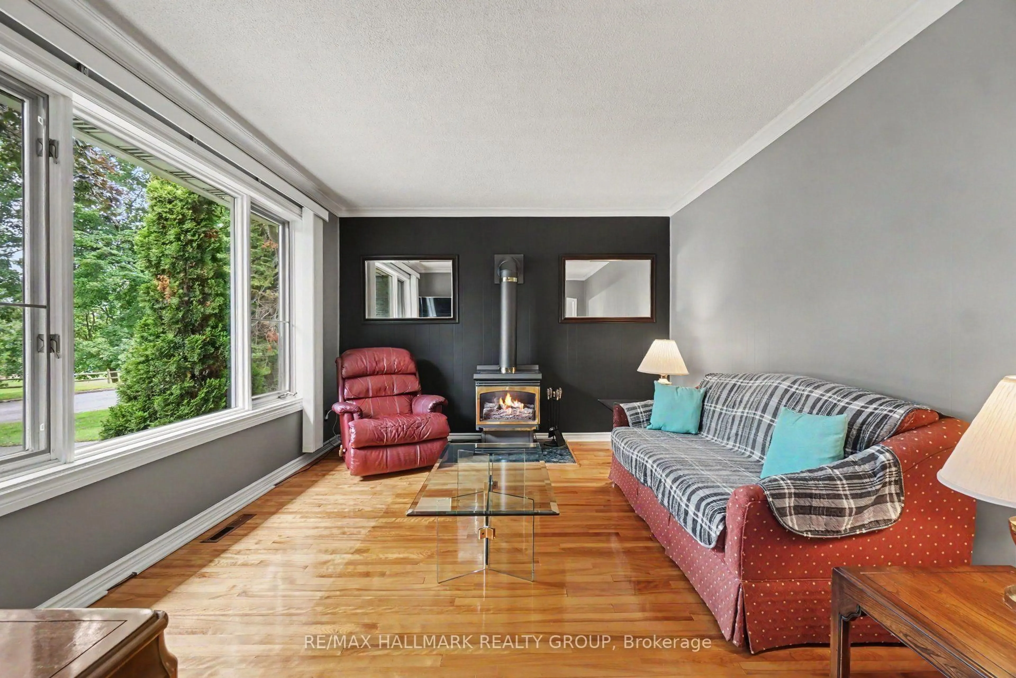 Living room with furniture, wood/laminate floor for 1839 Hutton Ave, Ottawa Ontario K1G 1M1