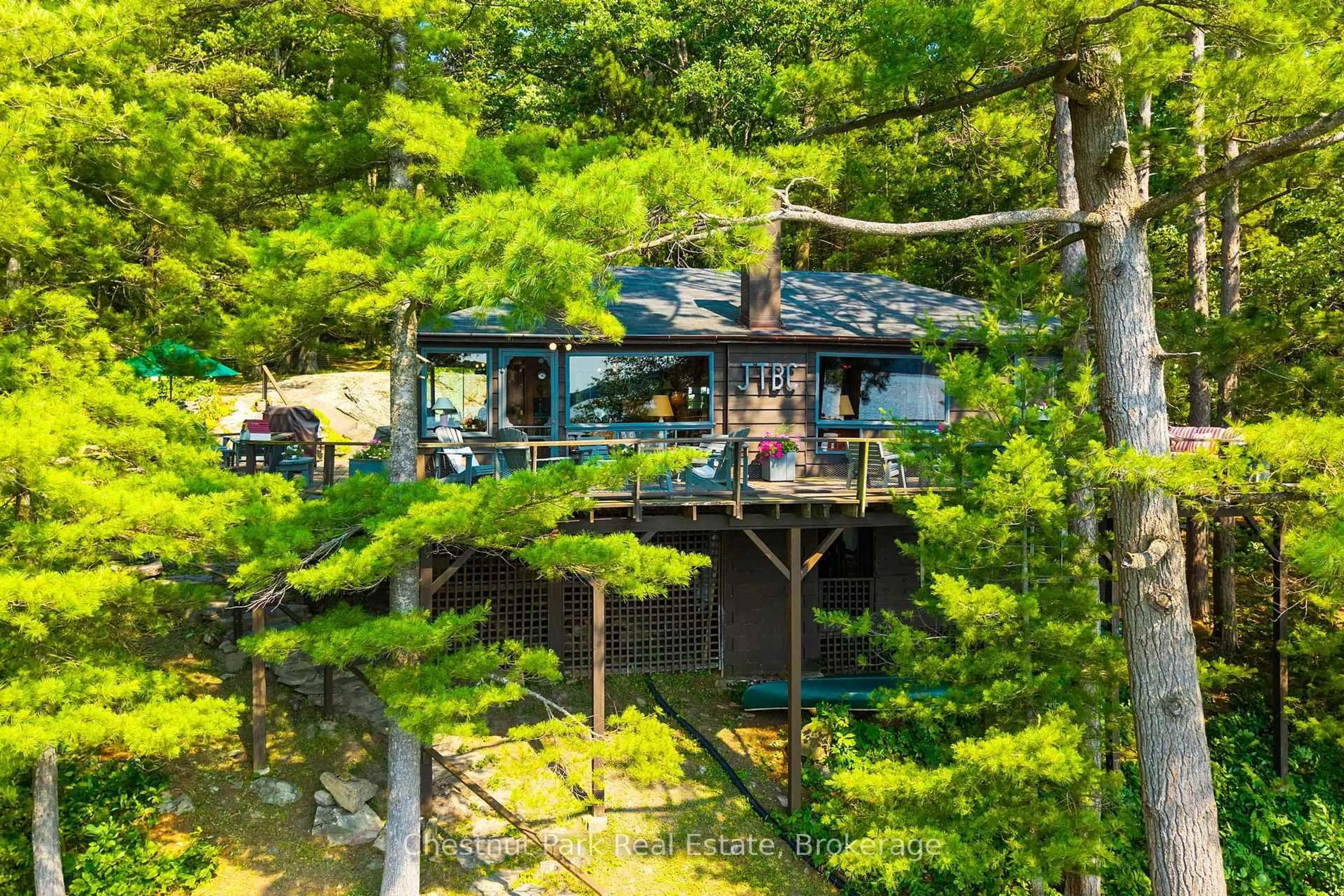 A pic from outside/outdoor area/front of a property/back of a property/a pic from drone, forest/trees view for 1181 Walkers Point Rd #9 (9 Renley Rd), Muskoka Lakes Ontario P1P 1R2