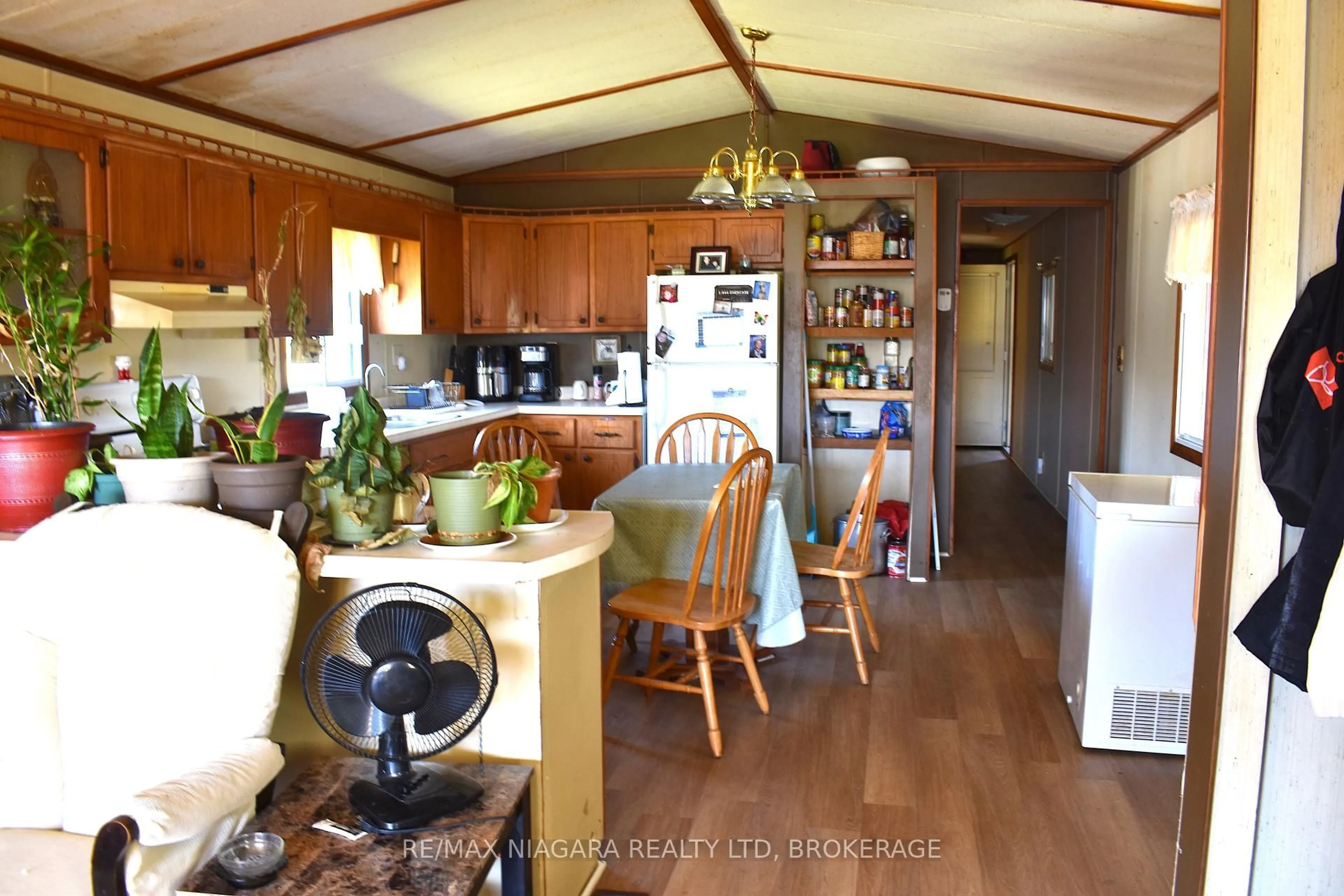 Open concept kitchen, wood/laminate floor for 2175 Mewburn Rd #67, Niagara Falls Ontario L2J 0A6