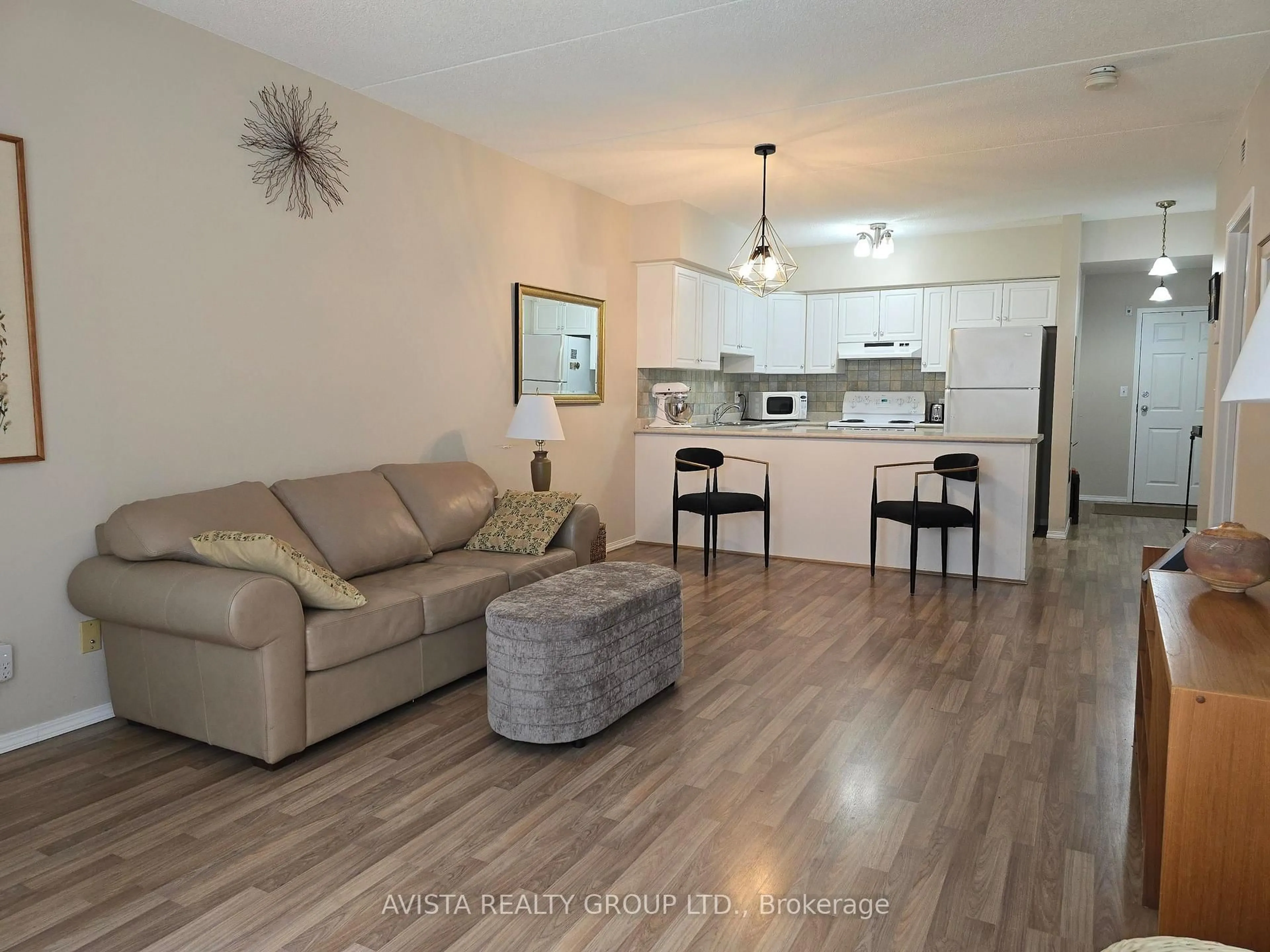 Living room with furniture, wood/laminate floor for 315 Hilldale Rd Suite 108, Thunder Bay Ontario P7G 1J7