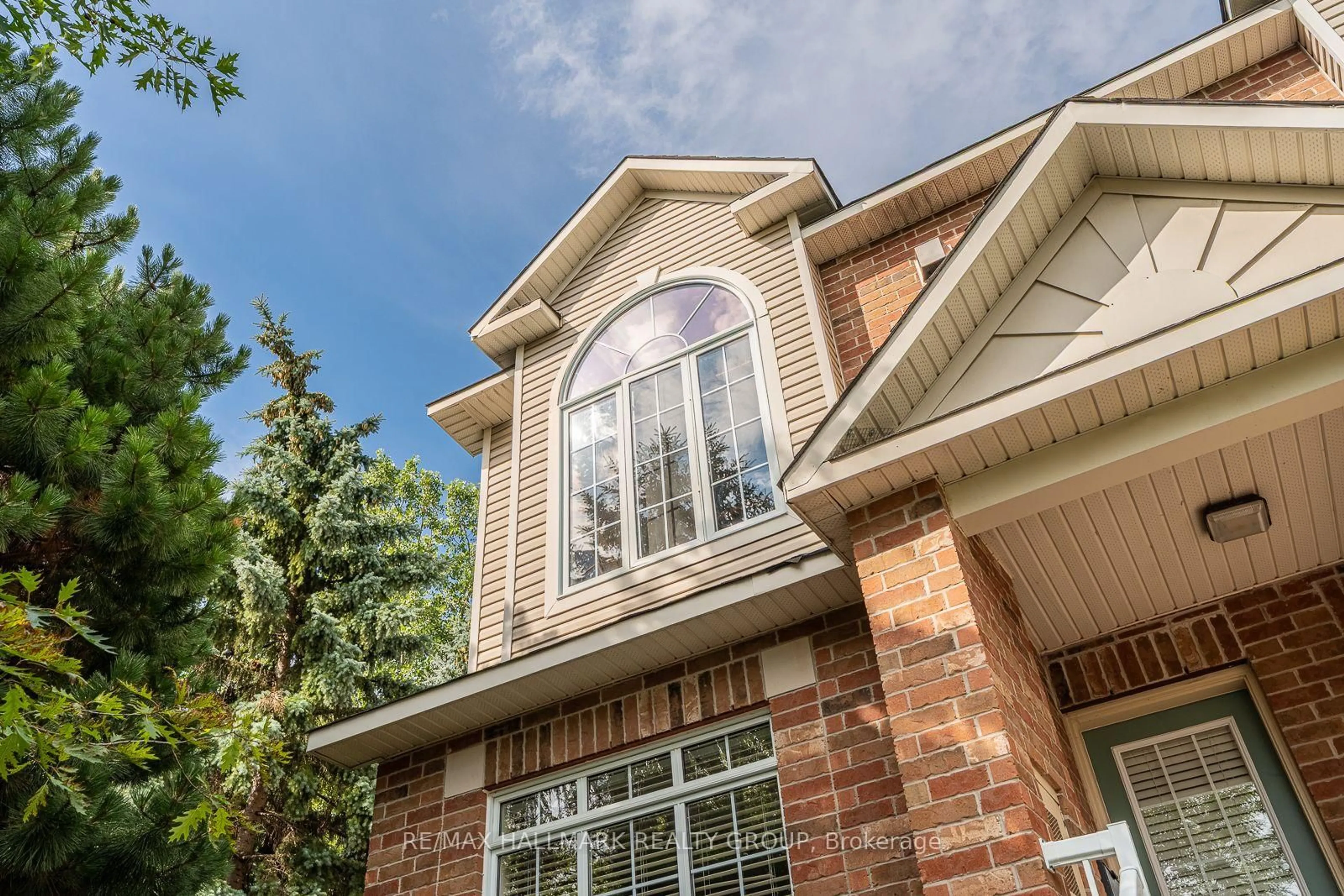 Home with brick exterior material, street for 142 Gatestone Private, Ottawa Ontario K1J 1K5