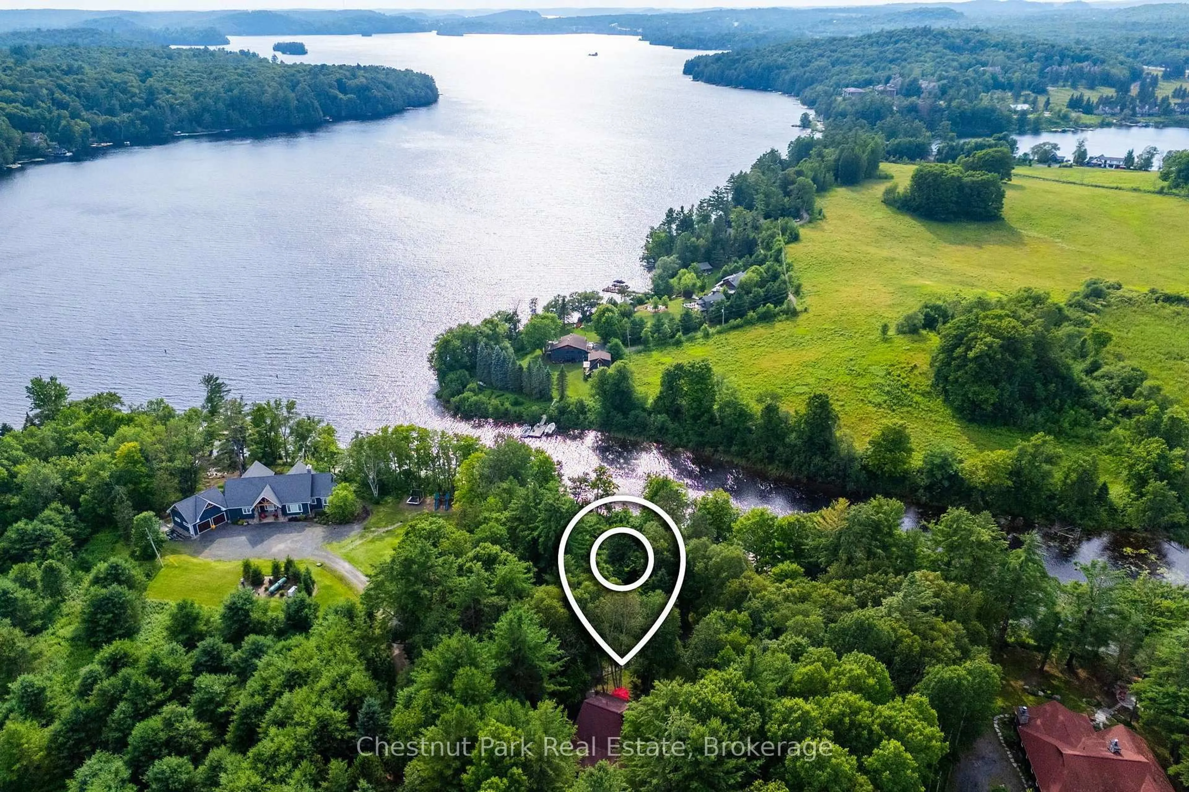 A pic from outside/outdoor area/front of a property/back of a property/a pic from drone, water/lake/river/ocean view for 90 Swallowdale Rd, Huntsville Ontario P1H 0A5