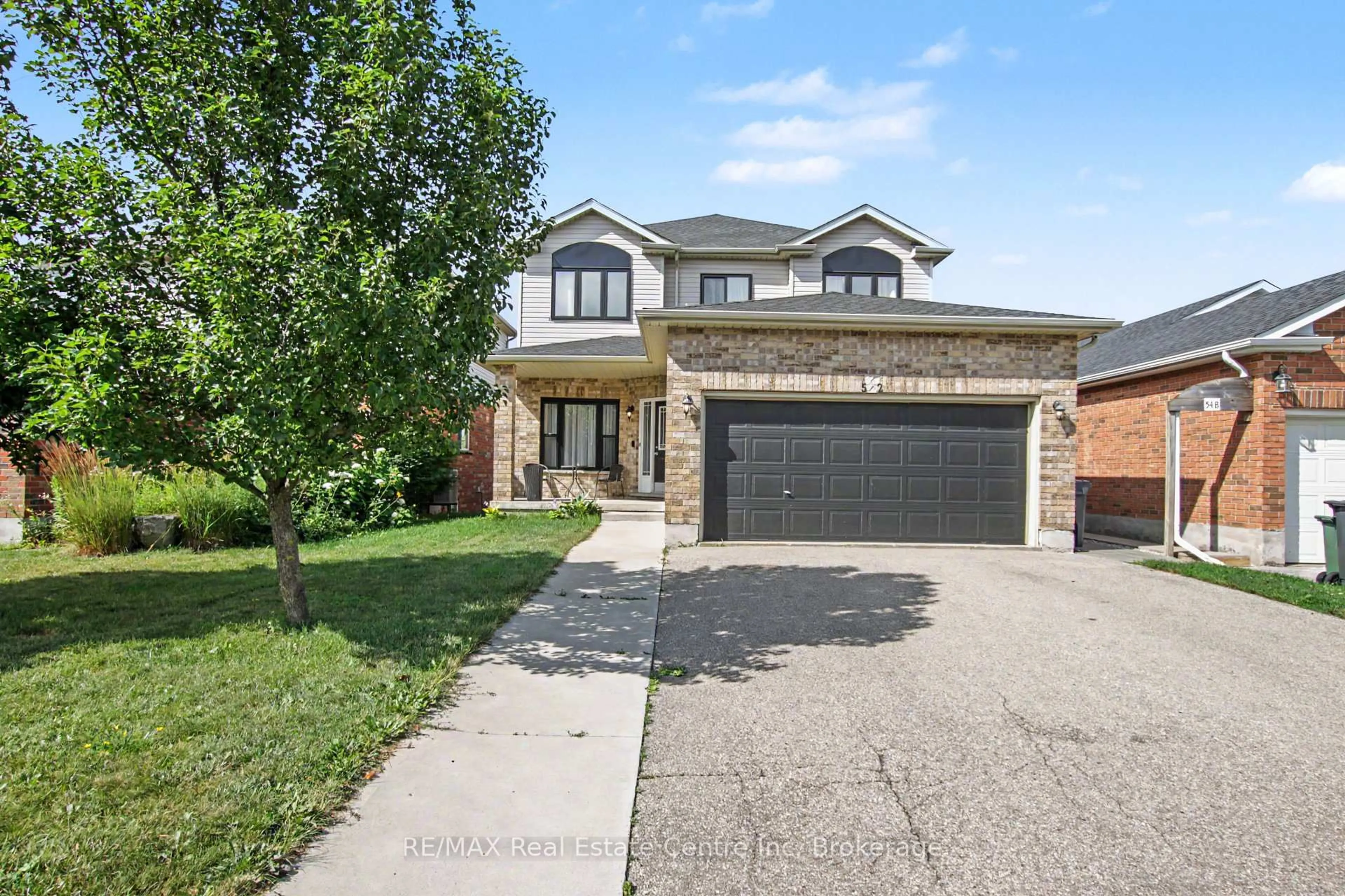 Home with brick exterior material, street for 52 Washburn Dr, Guelph Ontario N1E 0B2