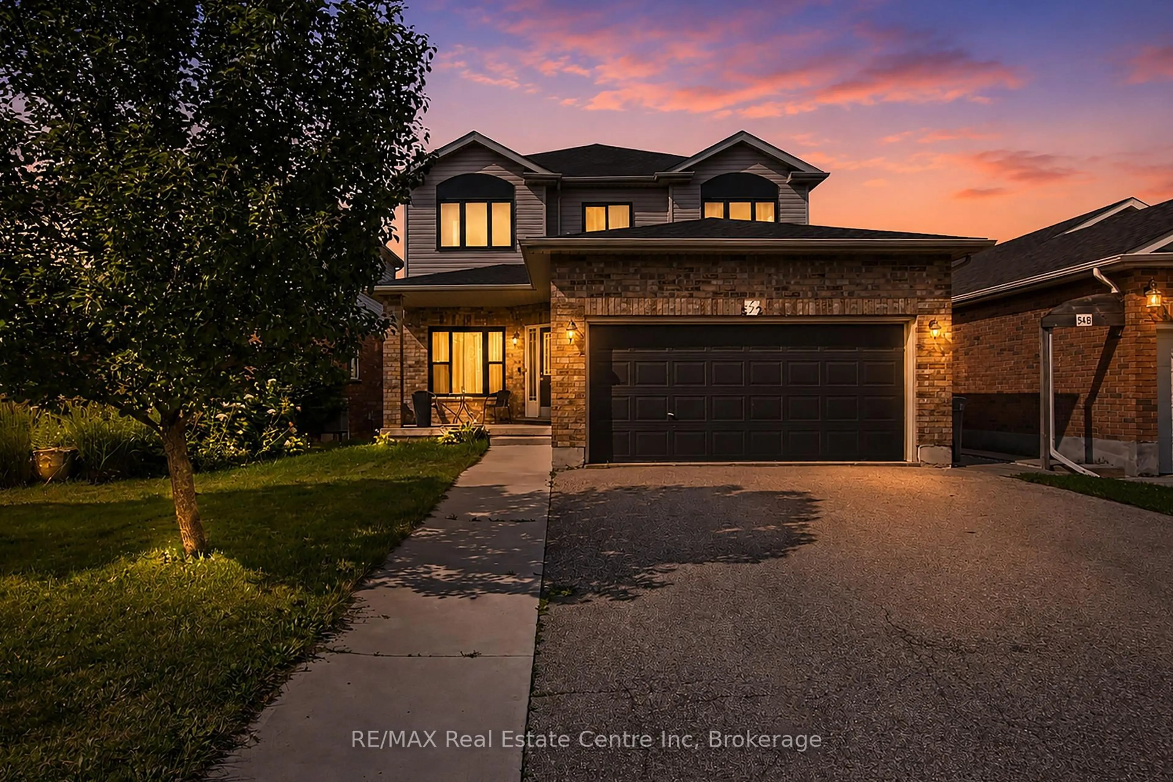 Home with brick exterior material, street for 52 Washburn Dr, Guelph Ontario N1E 0B2