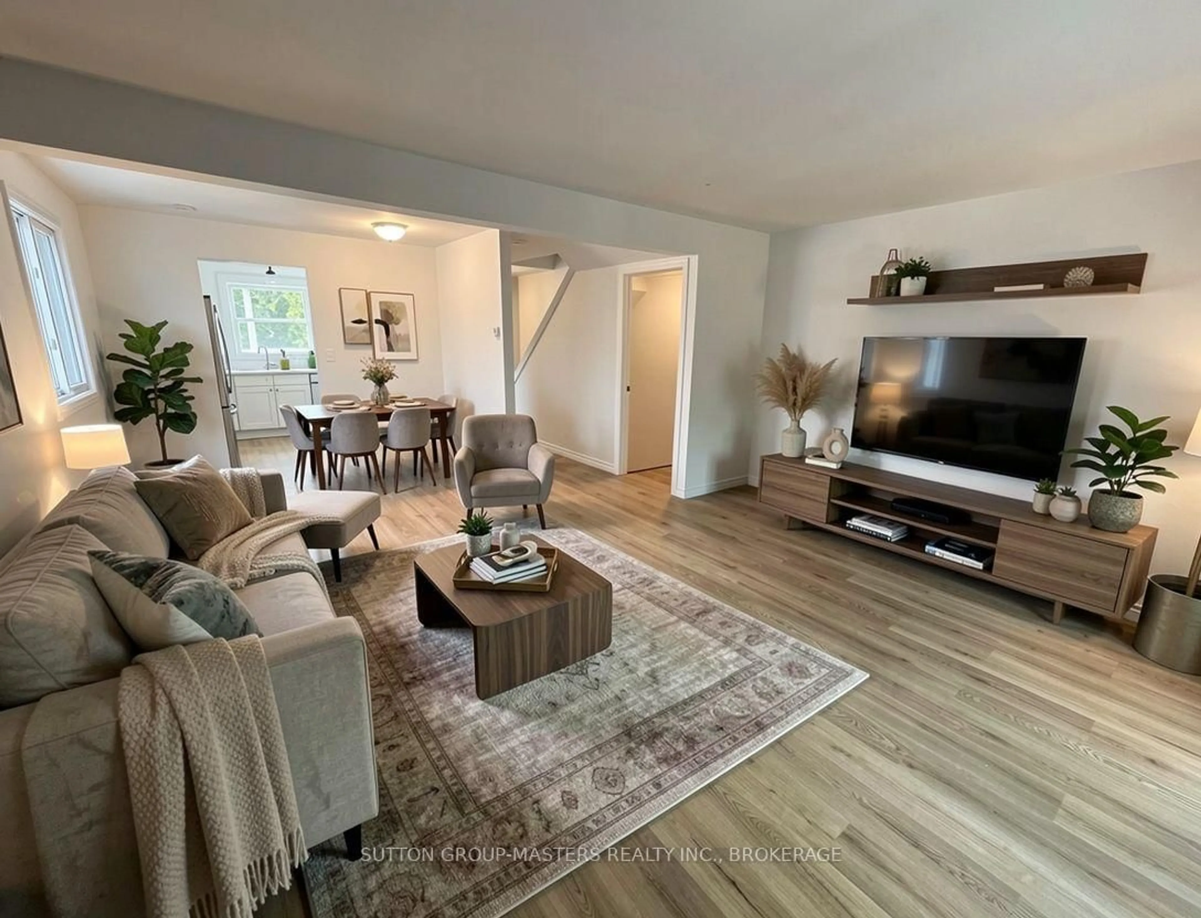 Living room with furniture, wood/laminate floor for 1124 Bittersweet Pl, Kingston Ontario K7P 2G9