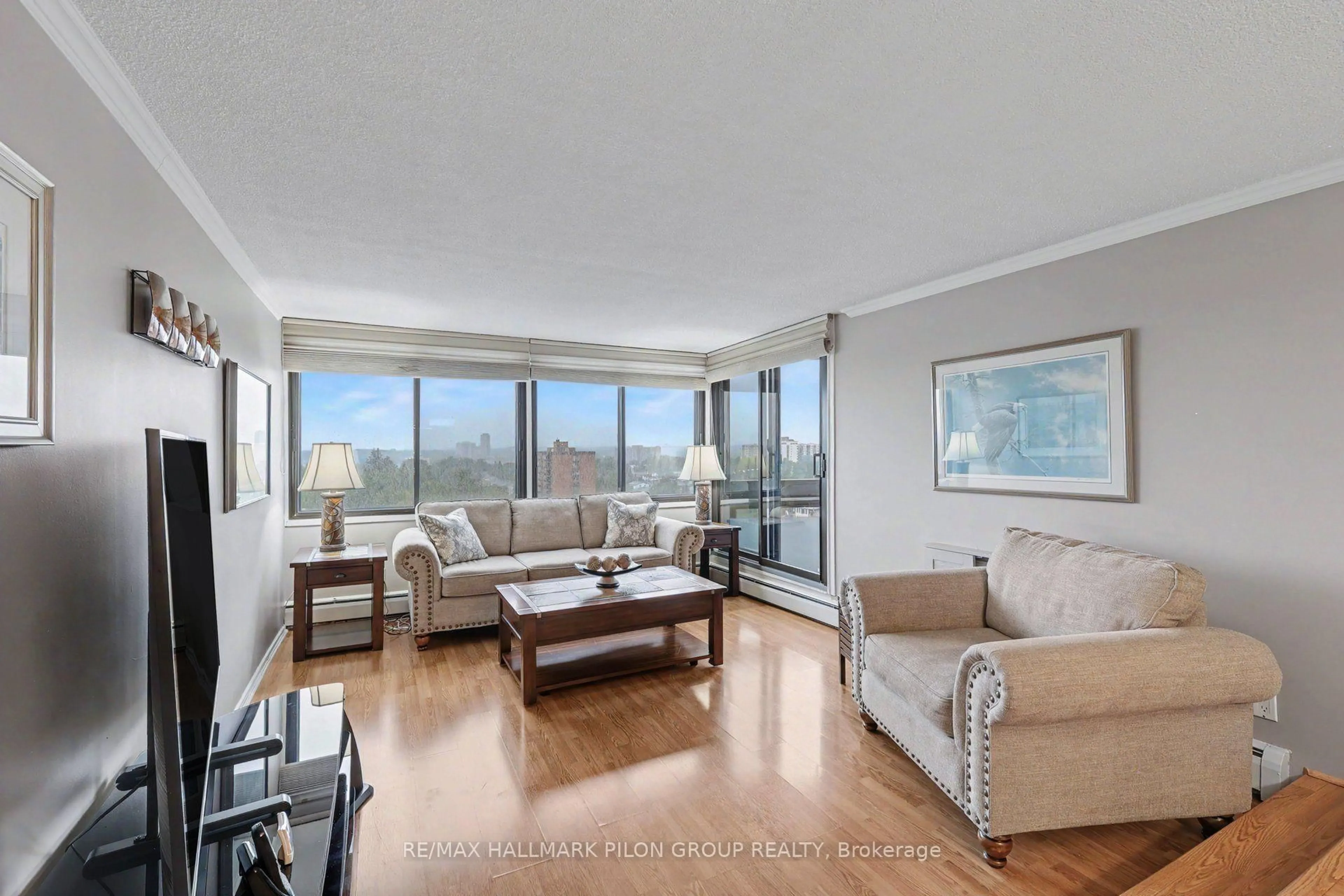 Living room with furniture, wood/laminate floor for 415 Greenview Ave #1305, Ottawa Ontario K2B 8G5