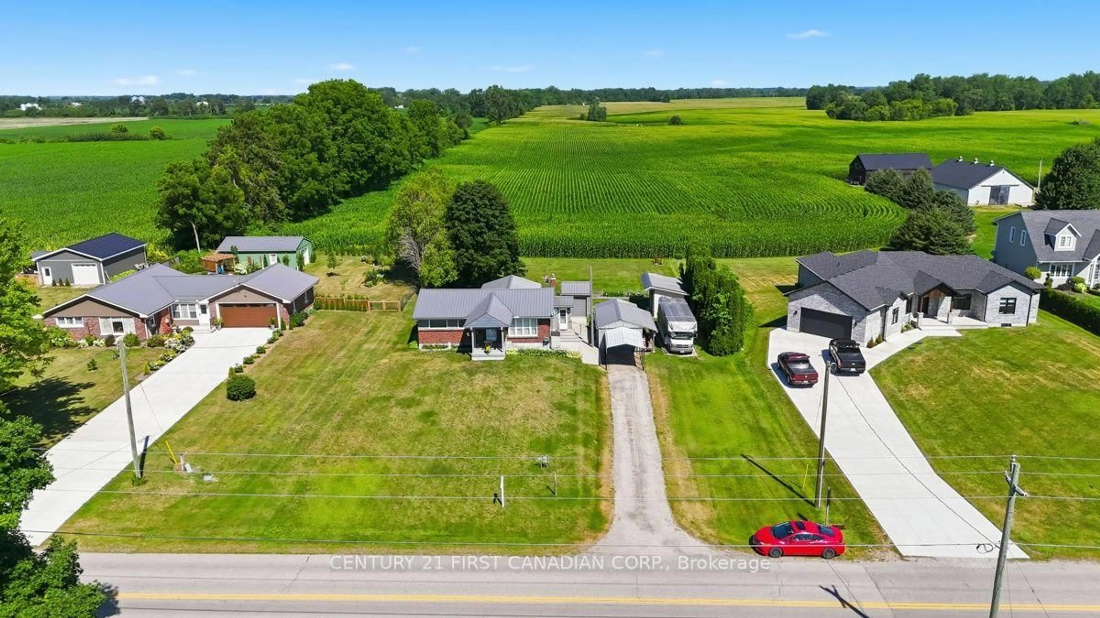 A pic from outside/outdoor area/front of a property/back of a property/a pic from drone, street for 22656 Queens Line, West Elgin Ontario N0L 2C0