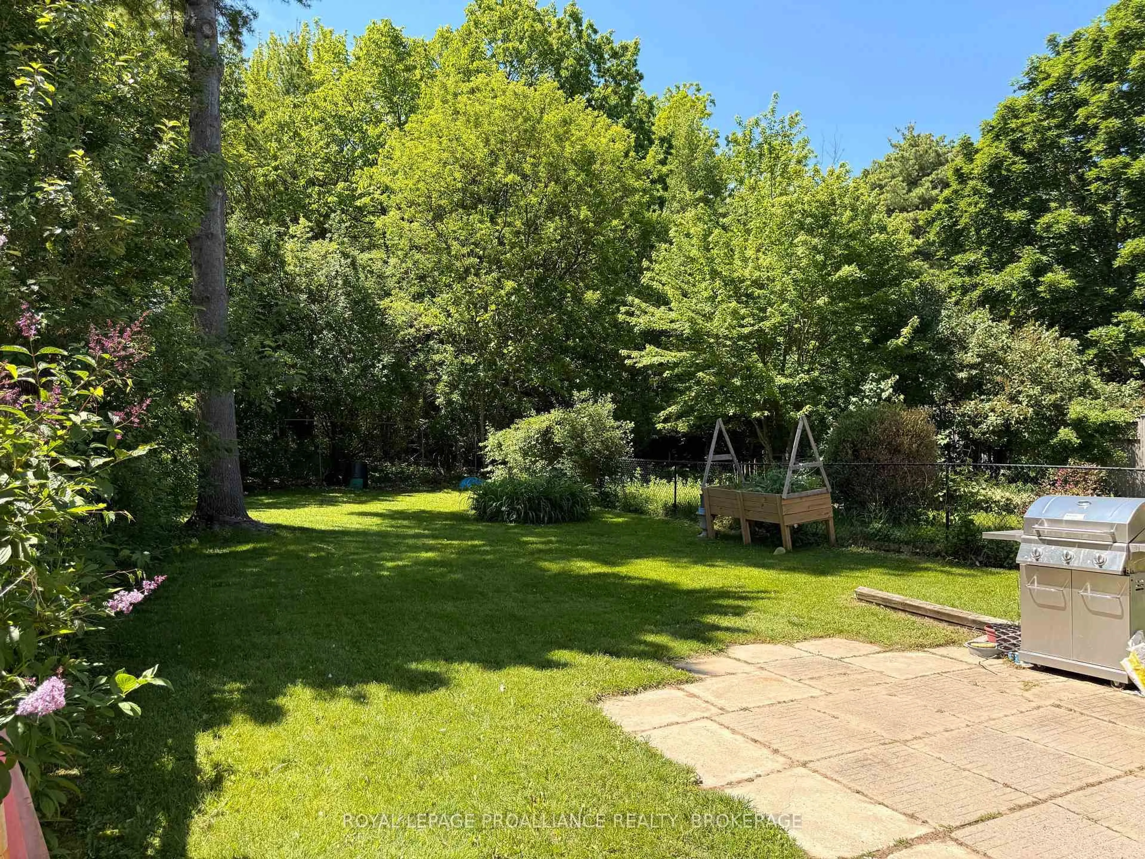 A pic from outside/outdoor area/front of a property/back of a property/a pic from drone, forest/trees view for 614 Barnsley Cres, Kingston Ontario K7M 8X4