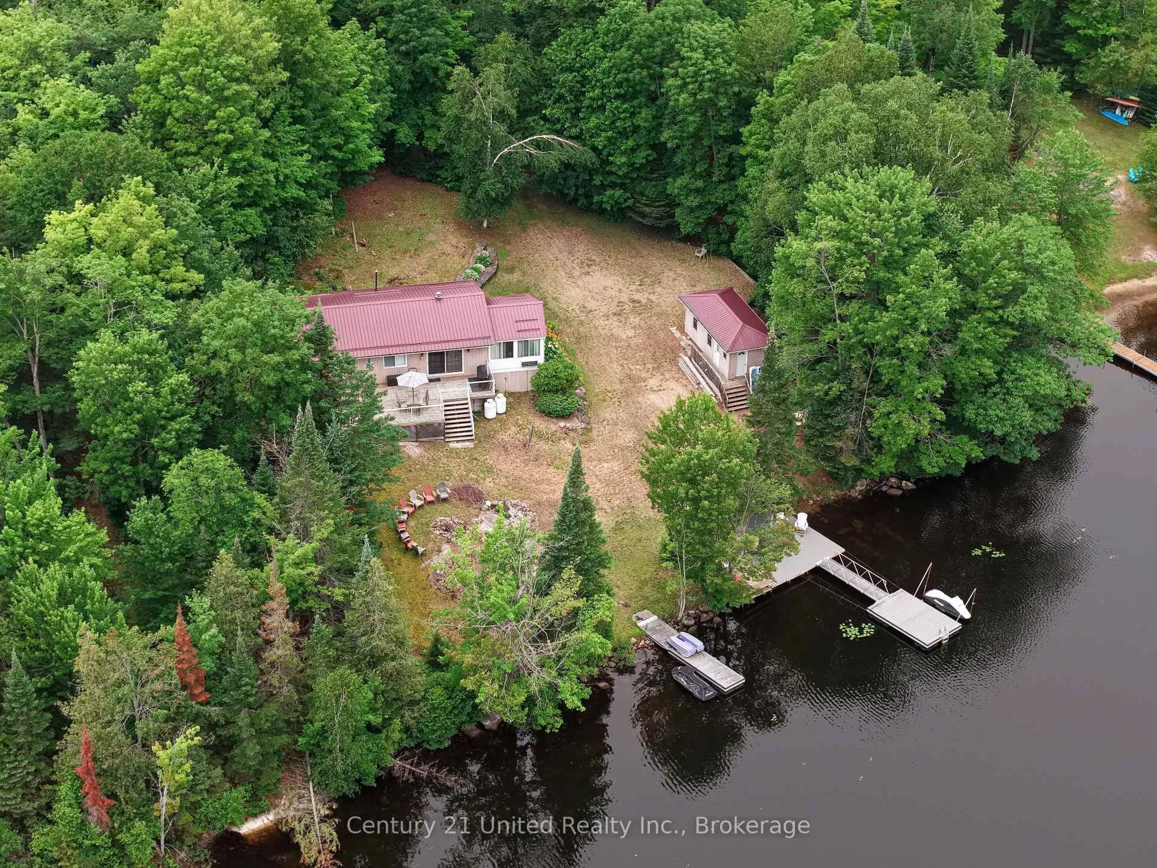 A pic from outside/outdoor area/front of a property/back of a property/a pic from drone, water/lake/river/ocean view for 1047 Redwood Lane, Highlands East Ontario K0L 1C0