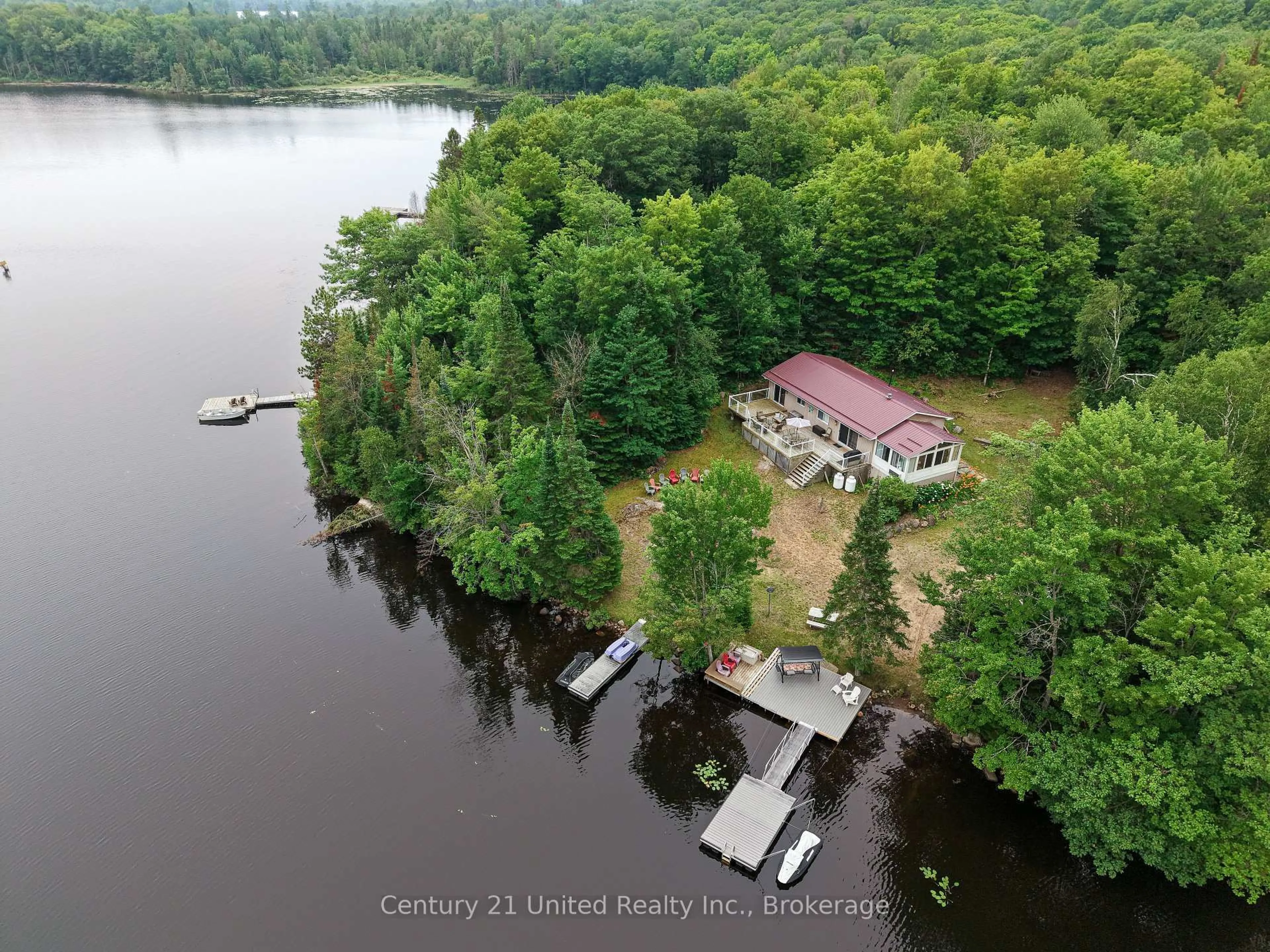 A pic from outside/outdoor area/front of a property/back of a property/a pic from drone, water/lake/river/ocean view for 1047 Redwood Lane, Highlands East Ontario K0L 1C0