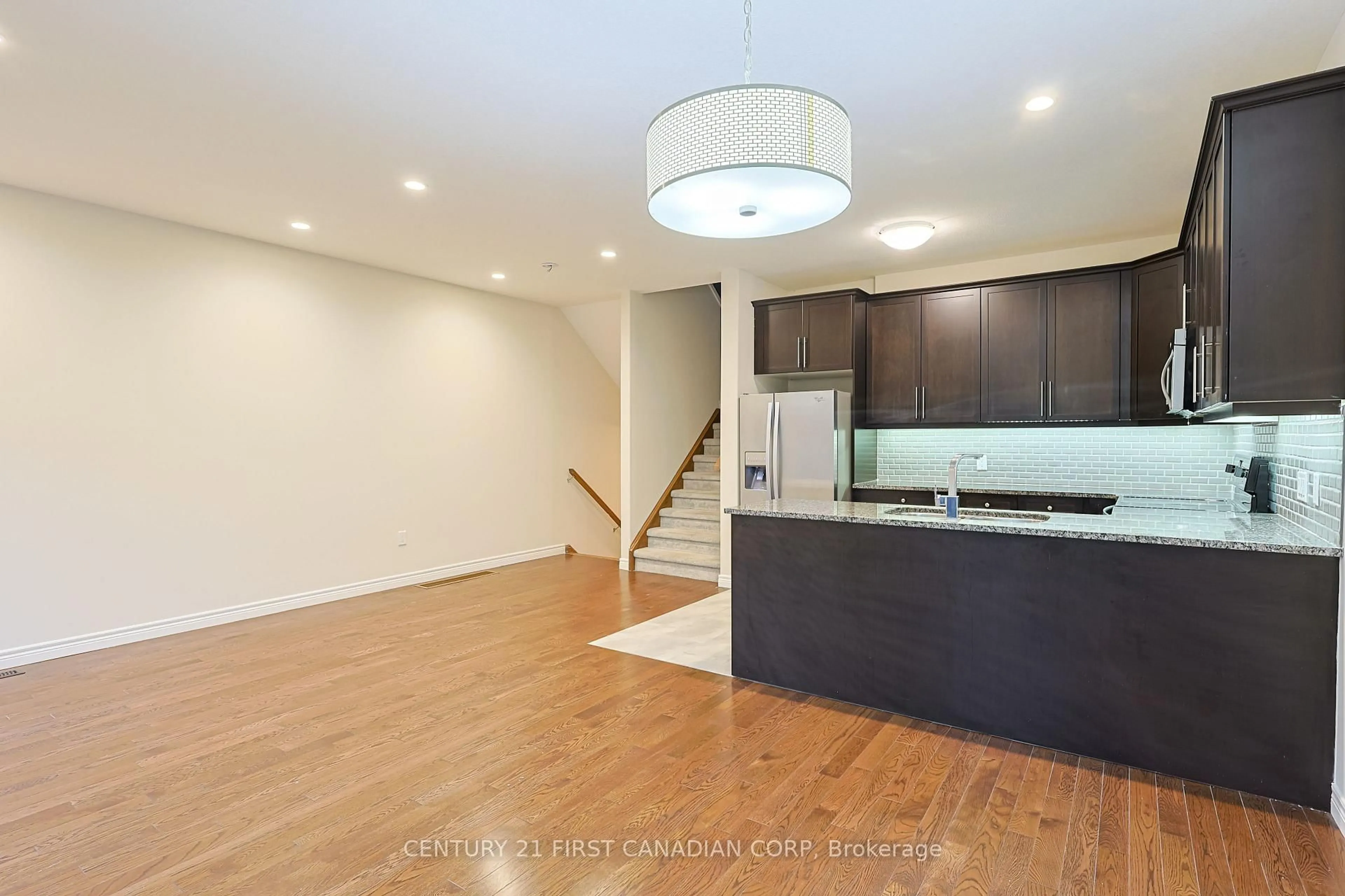Open concept kitchen, wood/laminate floor for 2235 Blackwater Rd #6, London North Ontario N5X 0L8