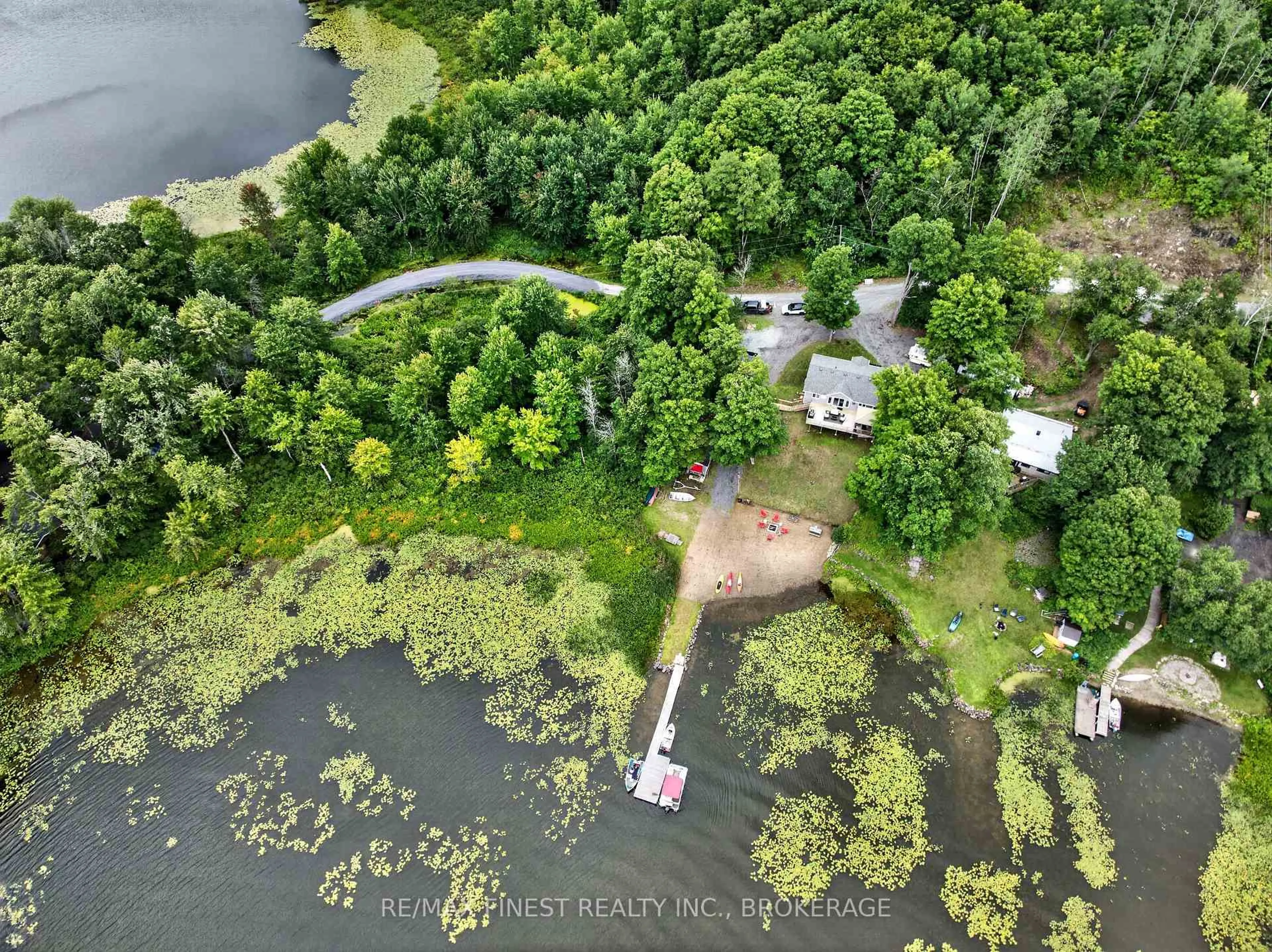 A pic from outside/outdoor area/front of a property/back of a property/a pic from drone, water/lake/river/ocean view for 1025 Parsons Point Lane, Verona Ontario K0H 2W0