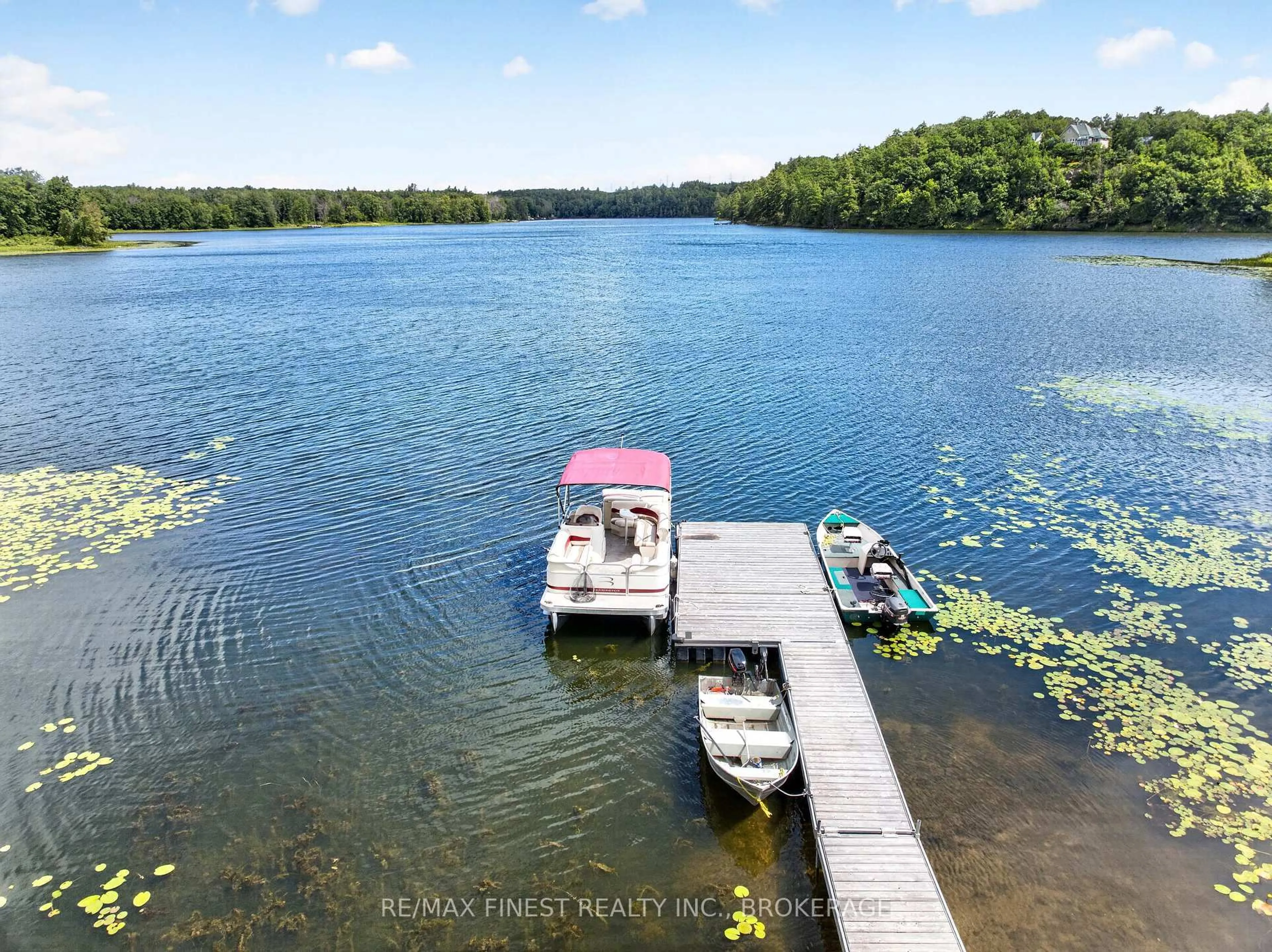 A pic from outside/outdoor area/front of a property/back of a property/a pic from drone, water/lake/river/ocean view for 1025 Parsons Point Lane, Verona Ontario K0H 2W0