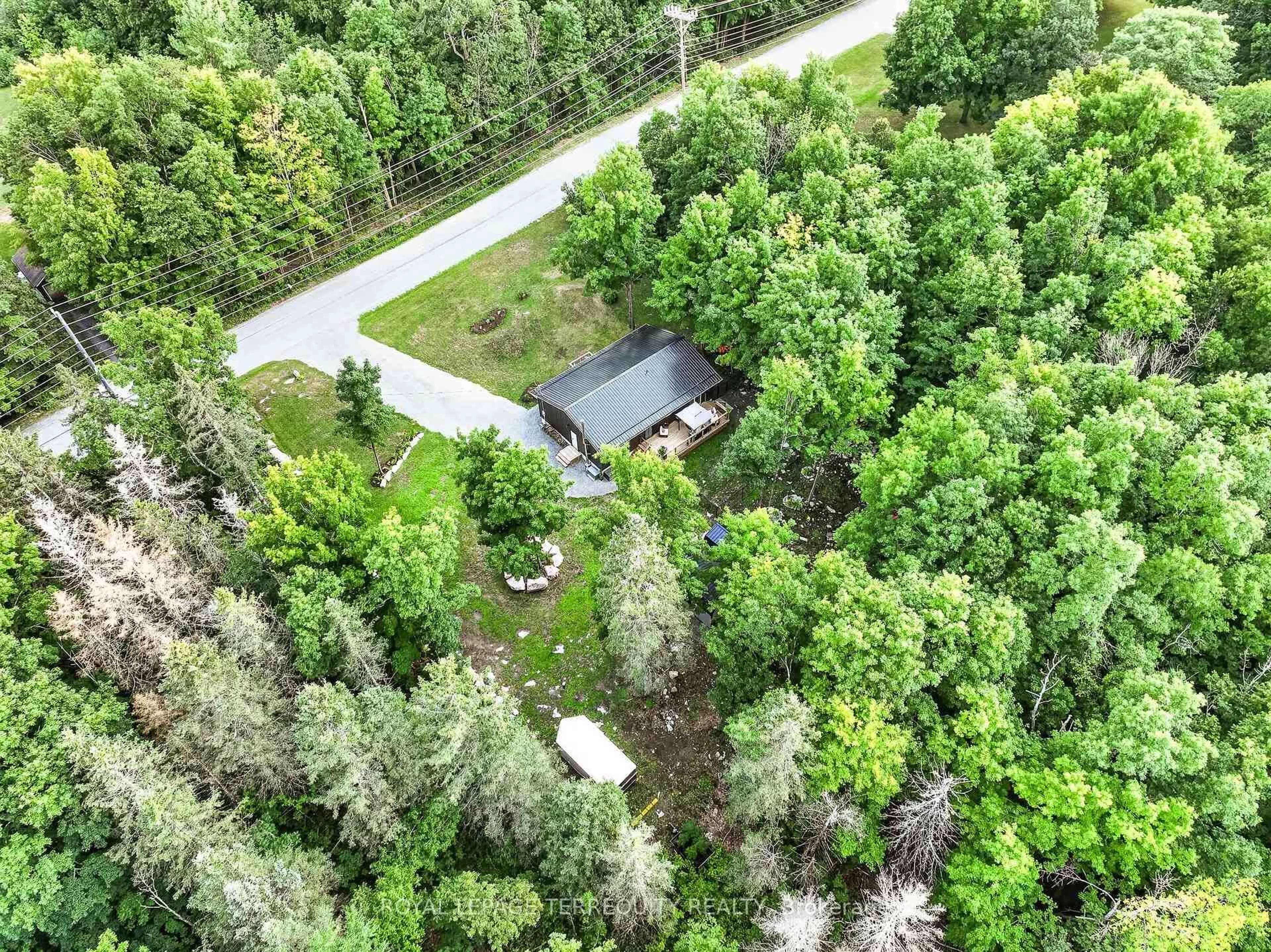 A pic from outside/outdoor area/front of a property/back of a property/a pic from drone, forest/trees view for 219 Station Rd, Limoges Ontario K0K 2M0