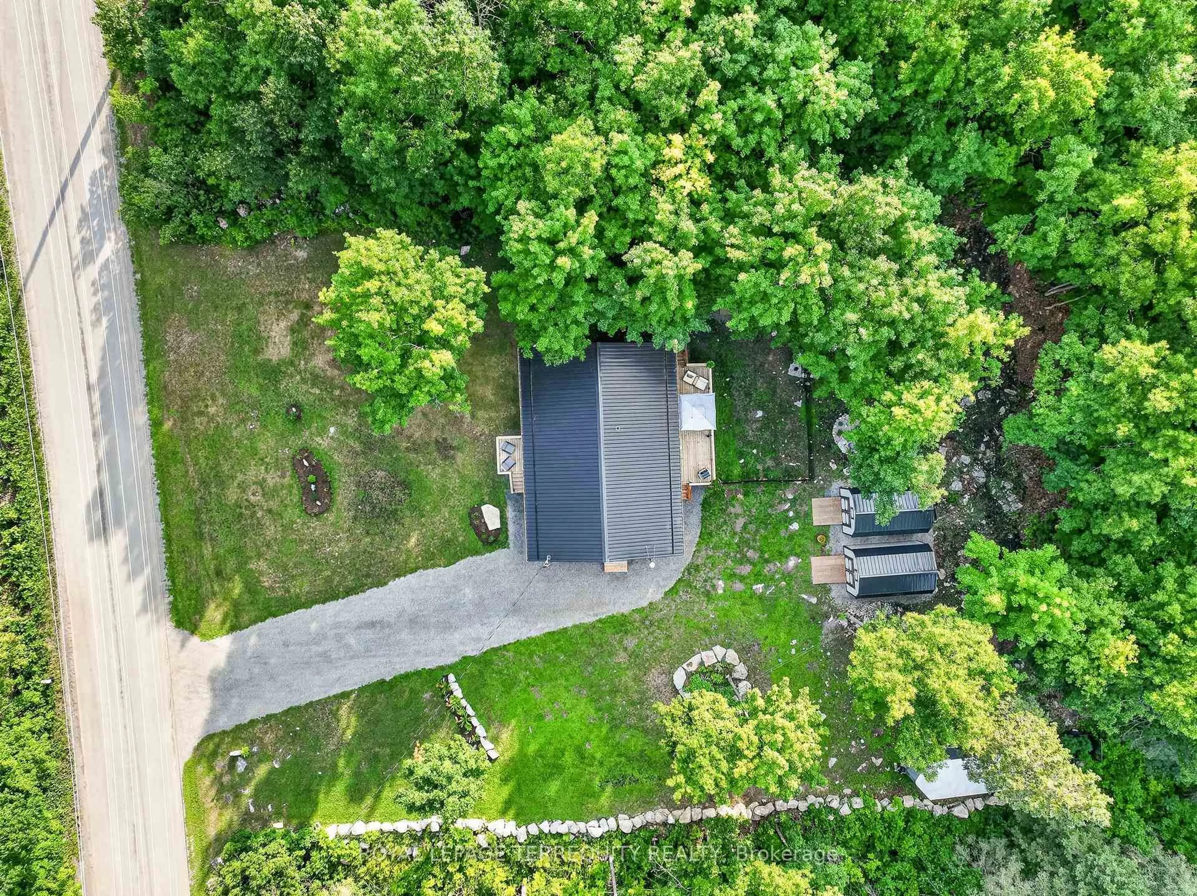 A pic from outside/outdoor area/front of a property/back of a property/a pic from drone, forest/trees view for 219 Station Rd, Limoges Ontario K0K 2M0