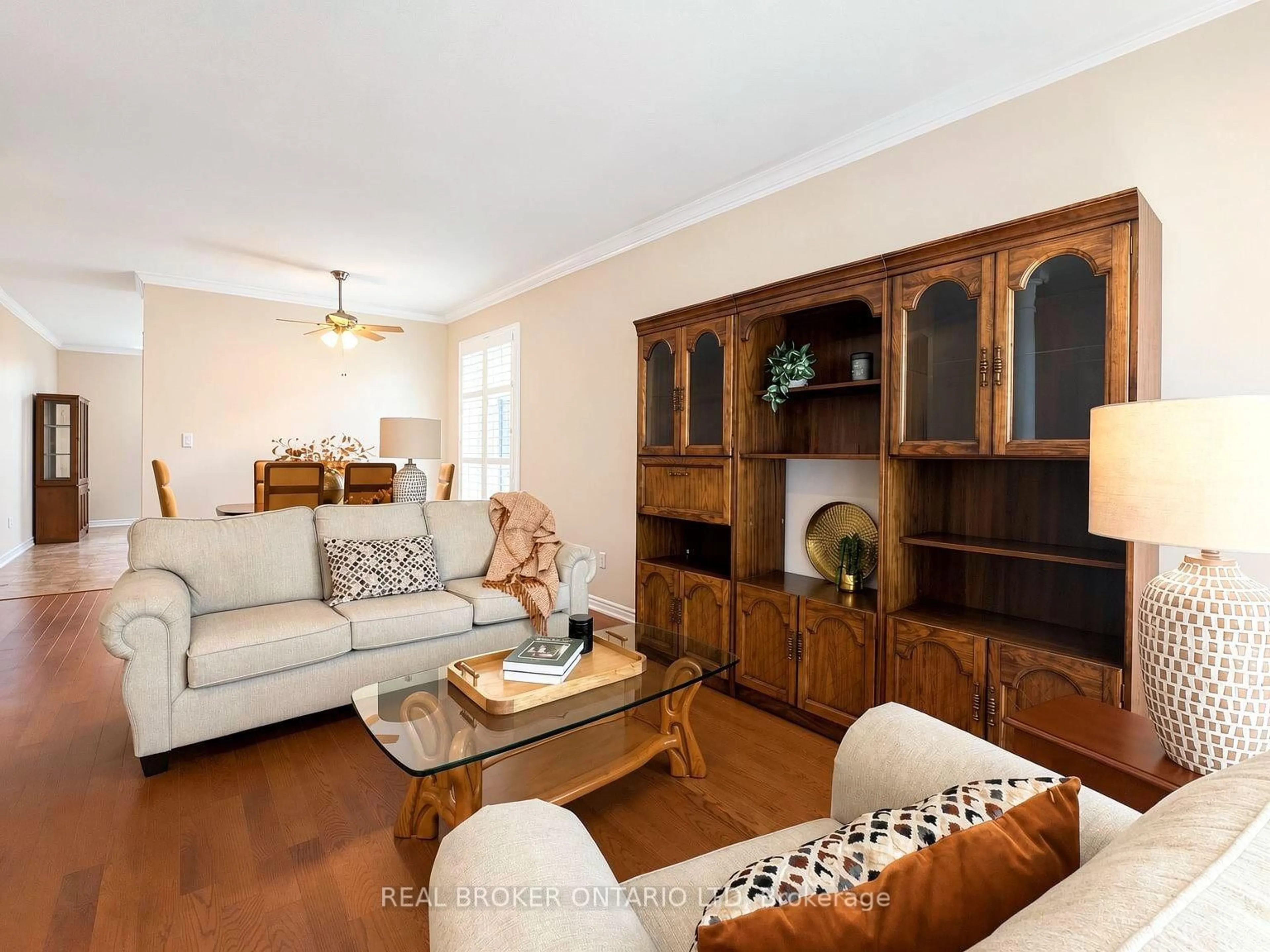 Living room with furniture, wood/laminate floor for 18 Cadeau Terr #14, London South Ontario N6K 4Z1