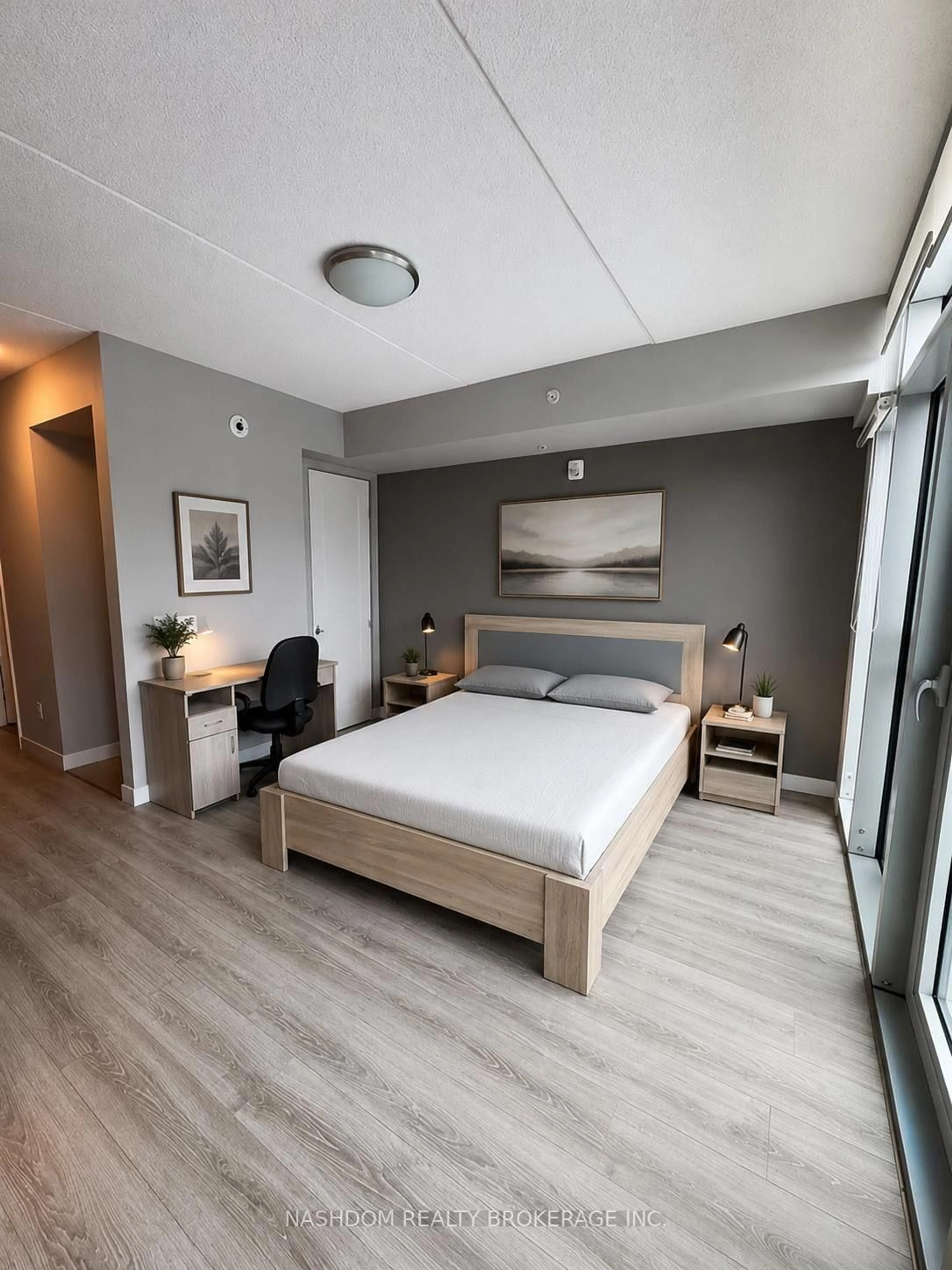 Bedroom with bed, wood/laminate floor for 250 Albert St #311, Waterloo Ontario N2L 0H5
