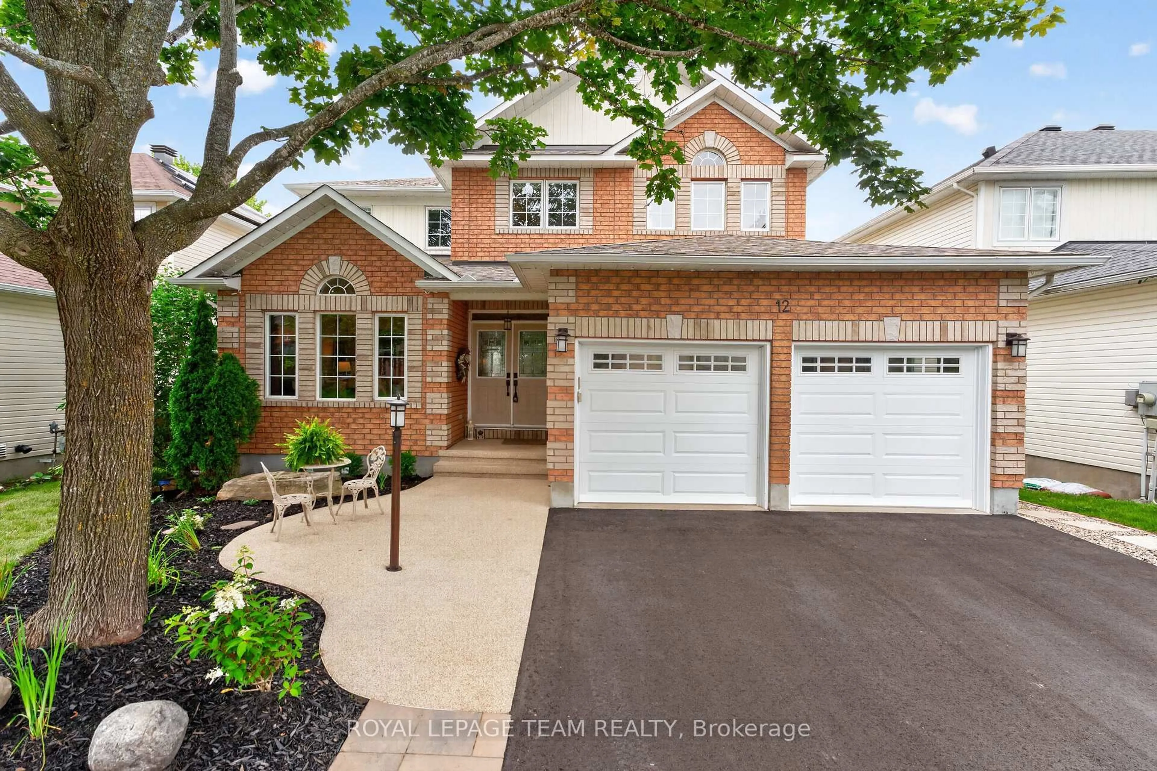 Home with brick exterior material, street for 12 Forillon Cres, Ottawa Ontario K2M 2W5