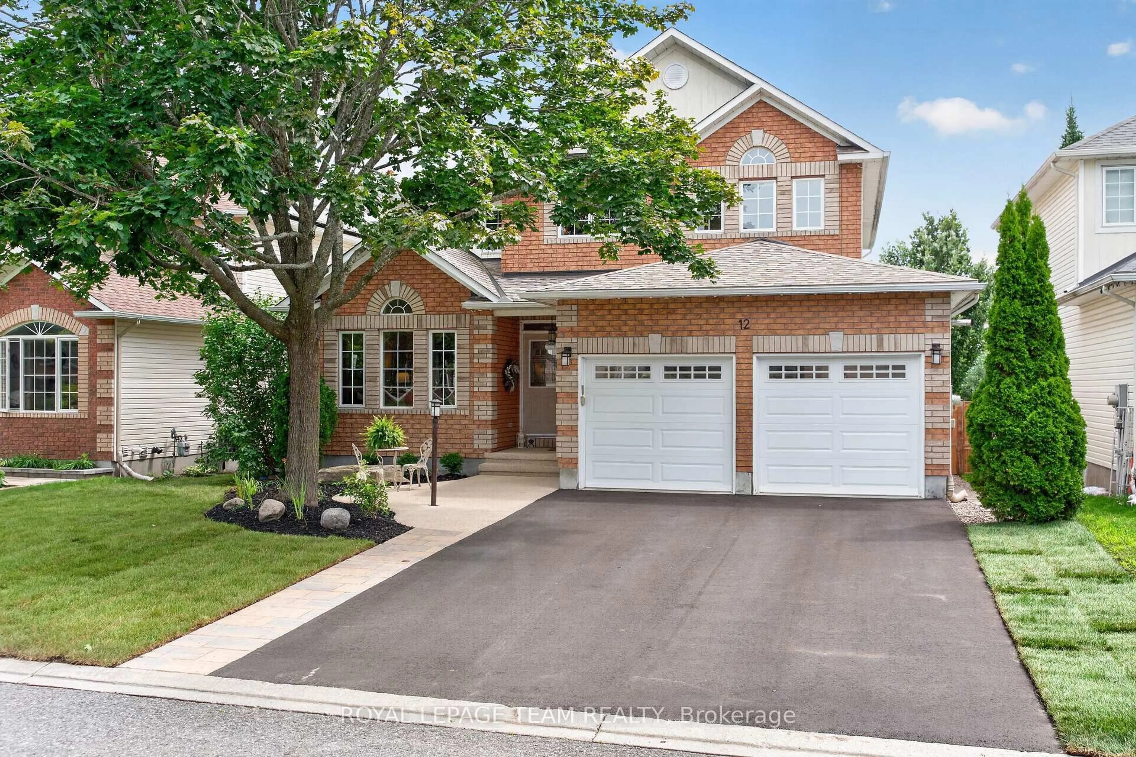 Home with brick exterior material, street for 12 Forillon Cres, Ottawa Ontario K2M 2W5