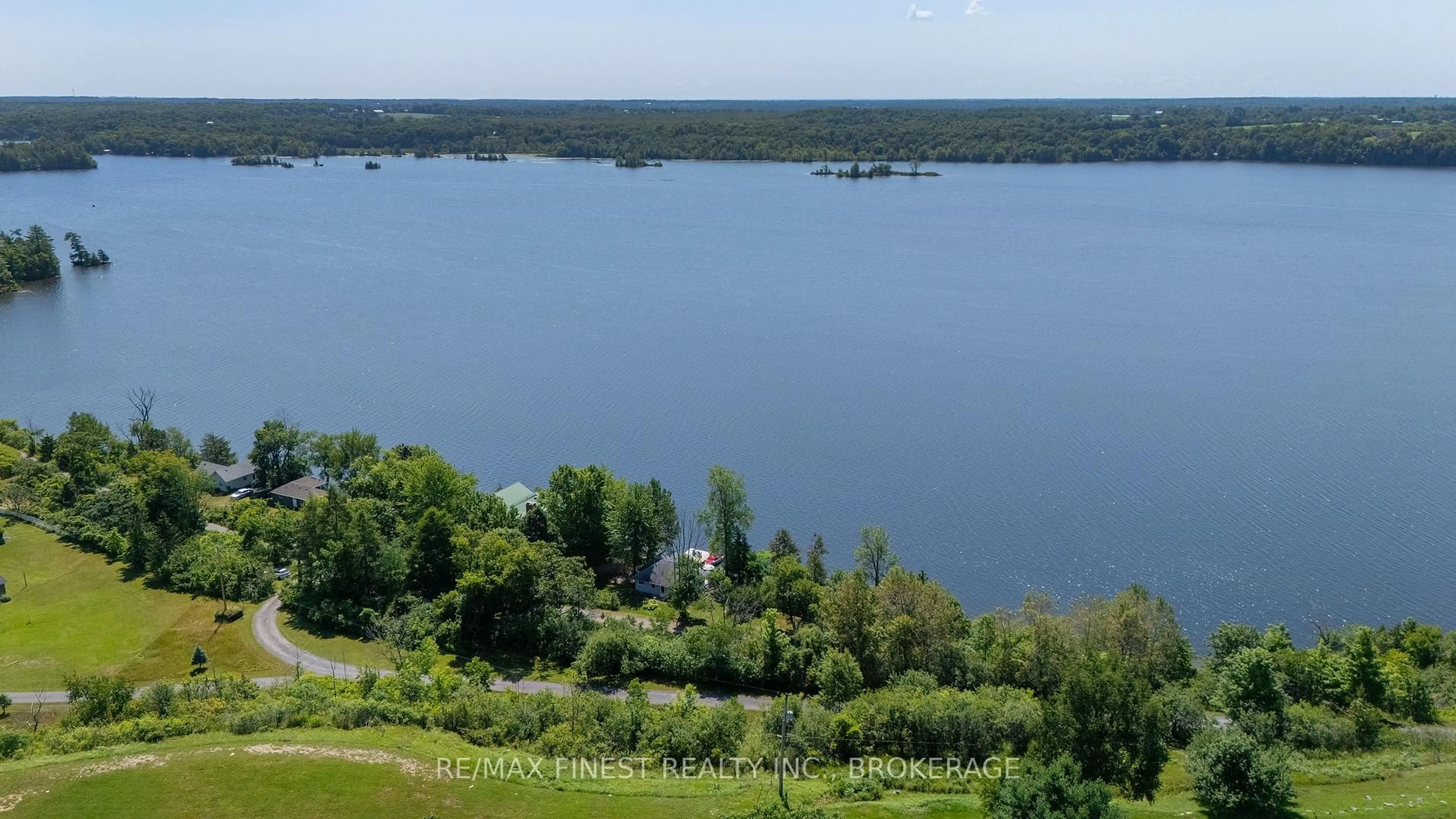 A pic from outside/outdoor area/front of a property/back of a property/a pic from drone, water/lake/river/ocean view for 1050 Anker Lane, Sydenham Ontario K0H 2T0