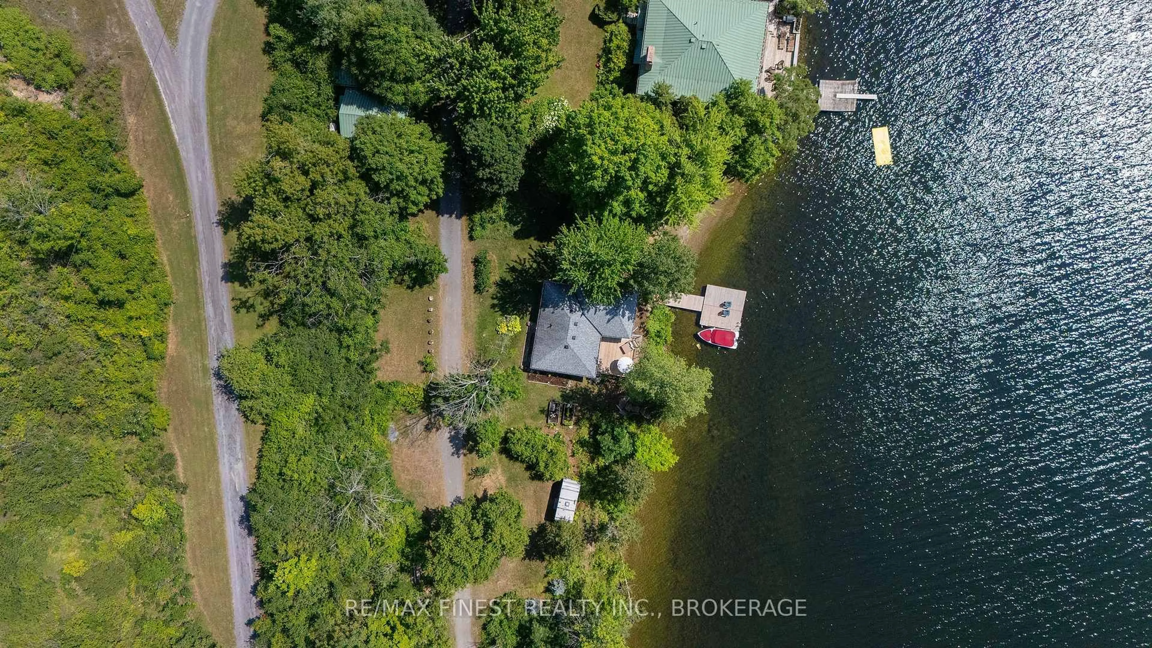A pic from outside/outdoor area/front of a property/back of a property/a pic from drone, water/lake/river/ocean view for 1050 Anker Lane, Sydenham Ontario K0H 2T0