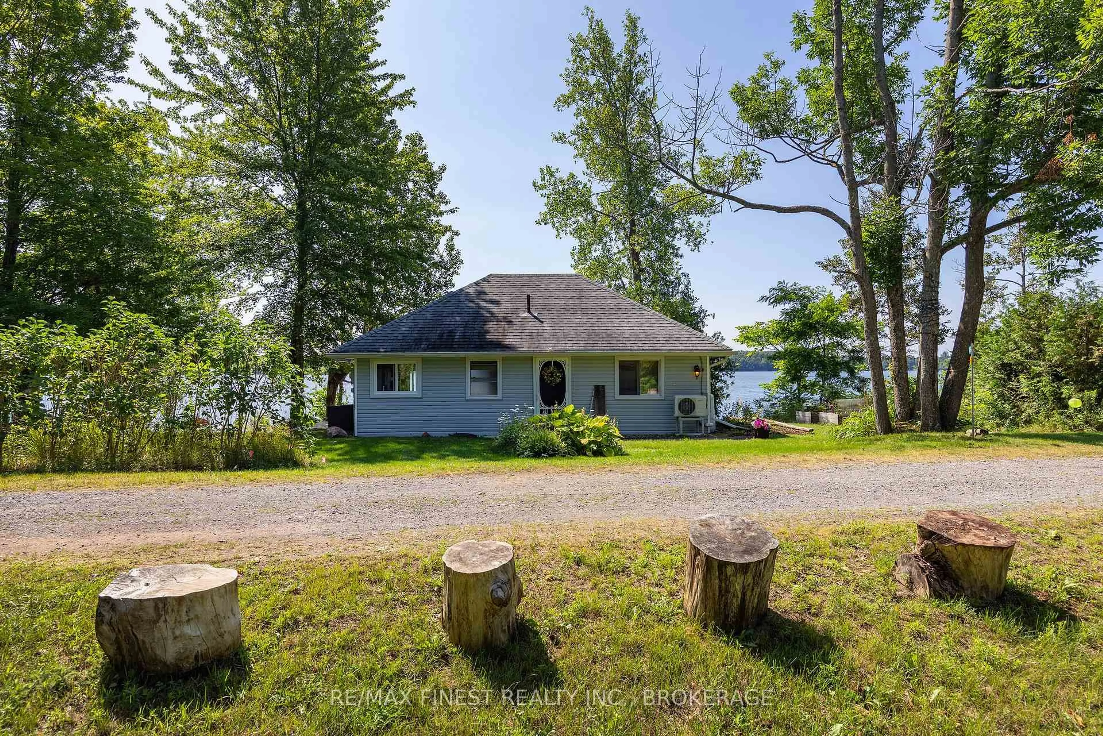 A pic from outside/outdoor area/front of a property/back of a property/a pic from drone, water/lake/river/ocean view for 1050 Anker Lane, Sydenham Ontario K0H 2T0