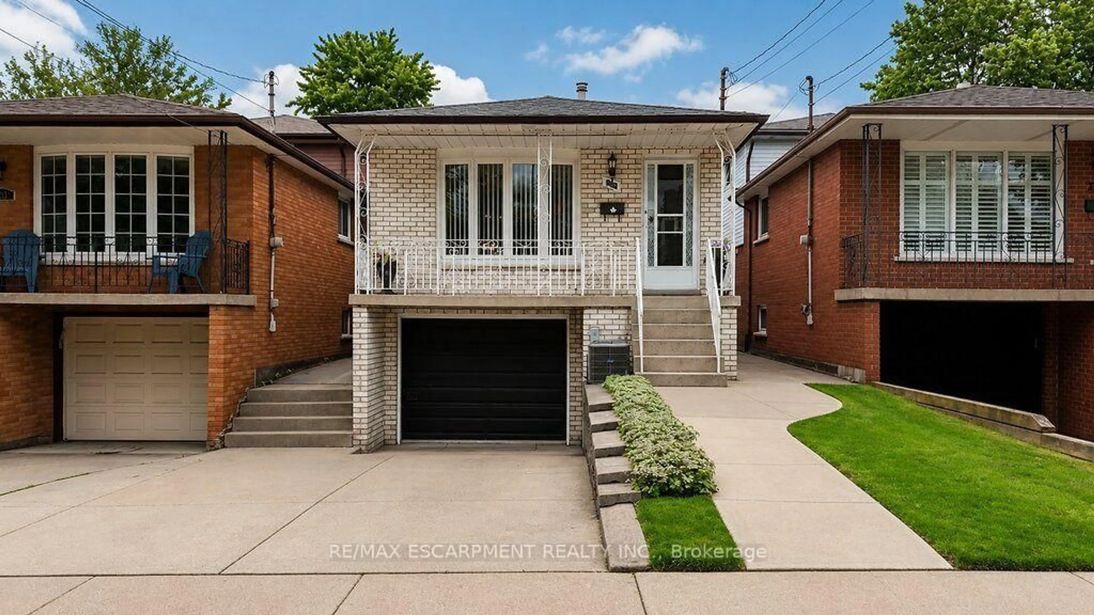 Home with brick exterior material, street for 229 East 8th St, Hamilton Ontario L9A 3L7