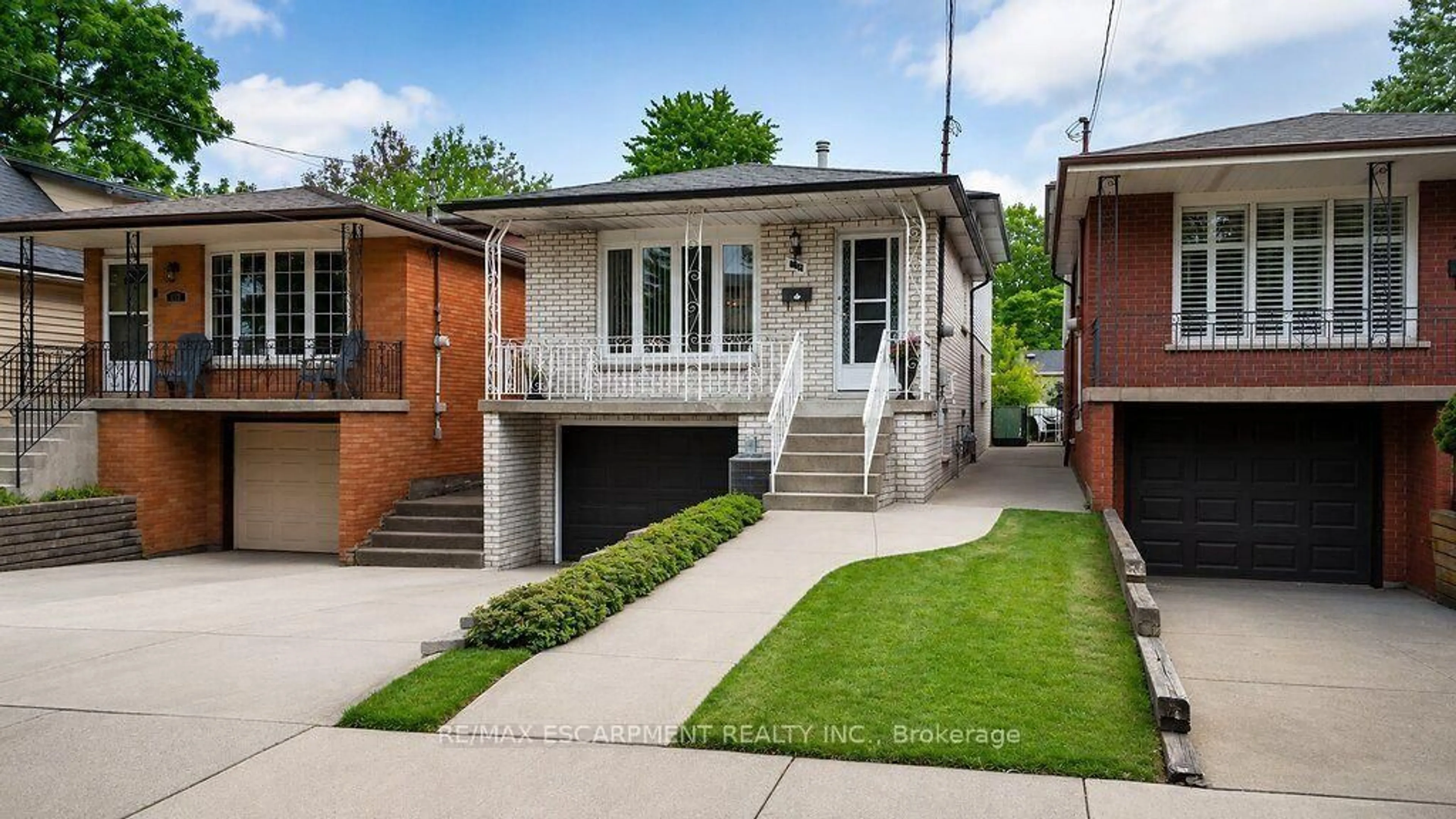 Home with brick exterior material, street for 229 East 8th St, Hamilton Ontario L9A 3L7