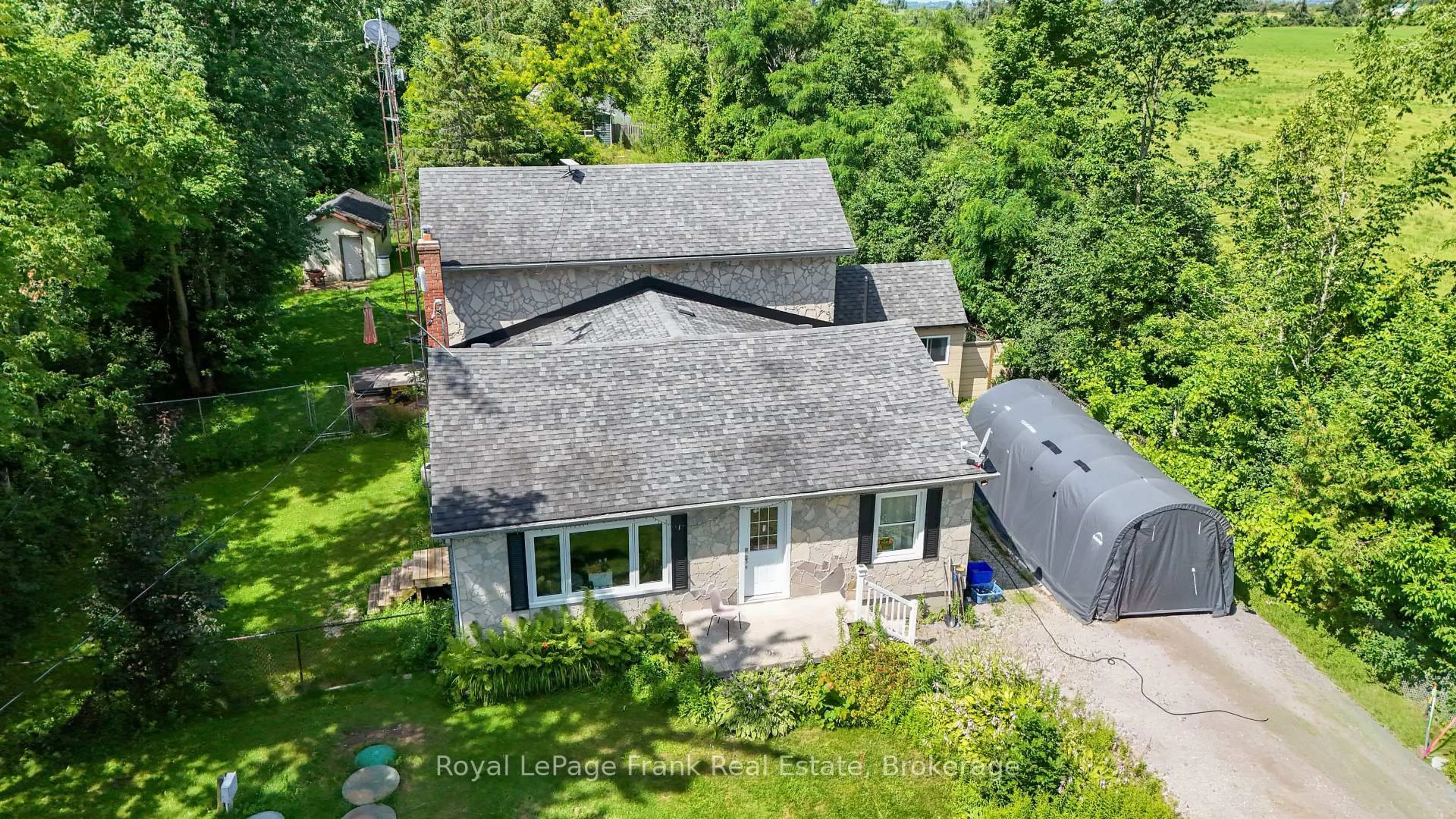 A pic from outside/outdoor area/front of a property/back of a property/a pic from drone, street for 2477 Pigeon Lake Rd, Kawartha Lakes Ontario K0M 1A0