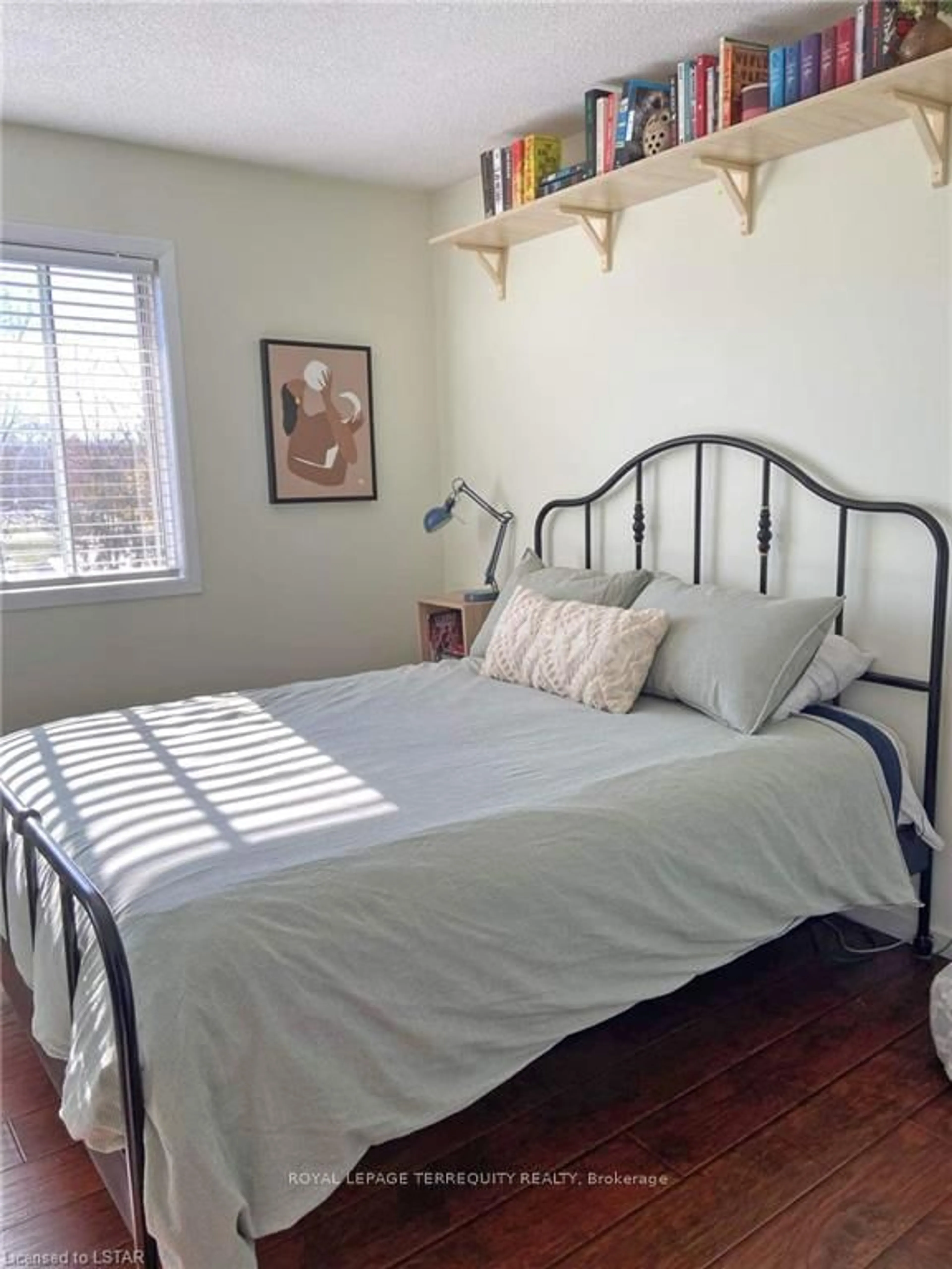 Bedroom with bed, wood/laminate floor for 2230 Trafalgar St #325, London East Ontario N5V 4J9