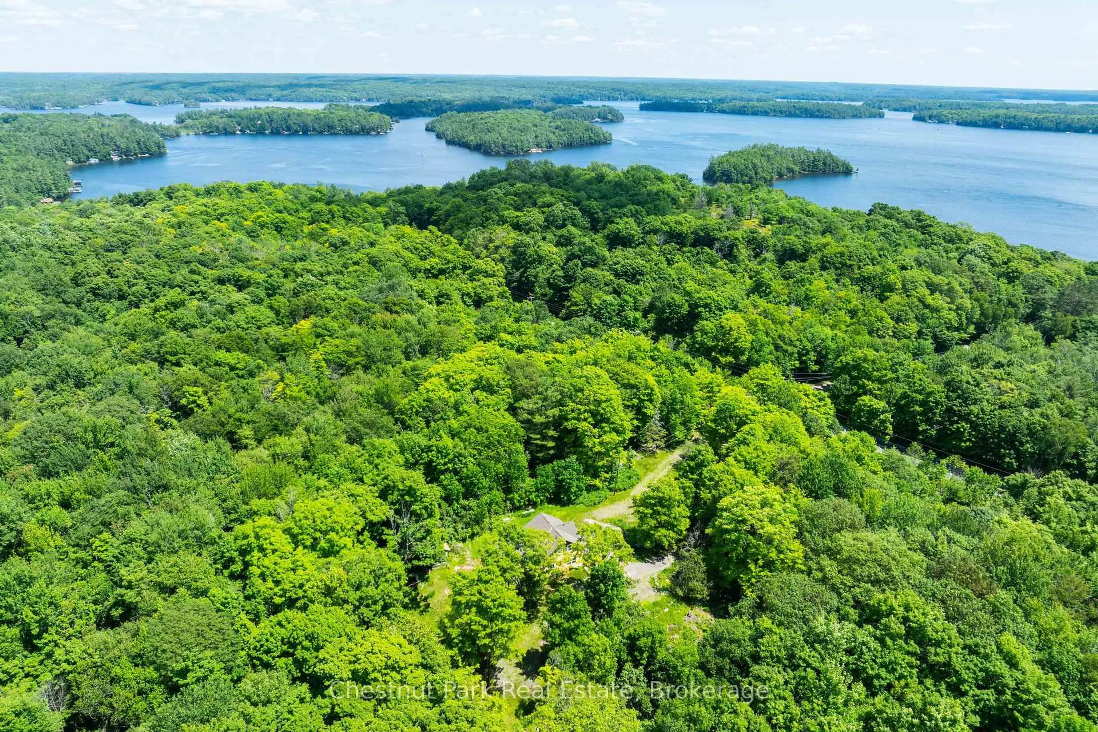 A pic from outside/outdoor area/front of a property/back of a property/a pic from drone, water/lake/river/ocean view for 1435 Juddhaven Rd, Muskoka Lakes Ontario P0B 1J0