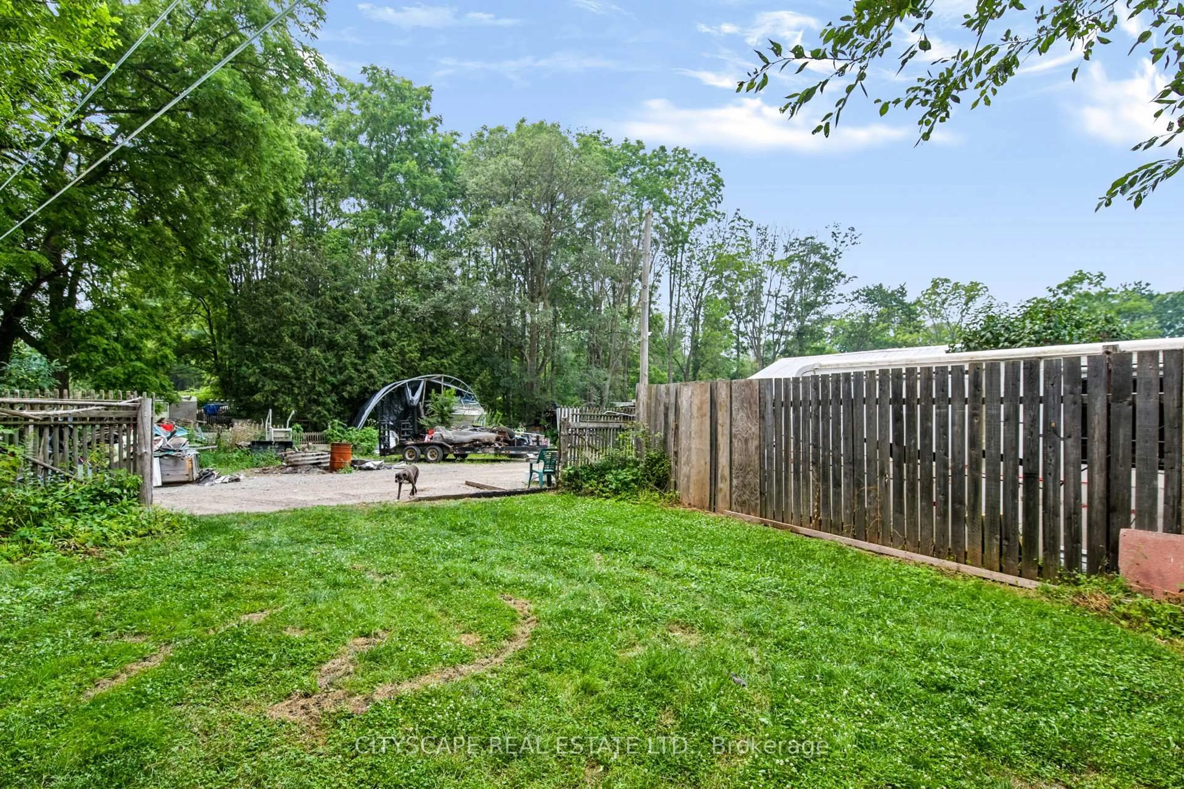 A pic from outside/outdoor area/front of a property/back of a property/a pic from drone, forest/trees view for 12 Enos St, Blandford-Blenheim Ontario N0J 1G0
