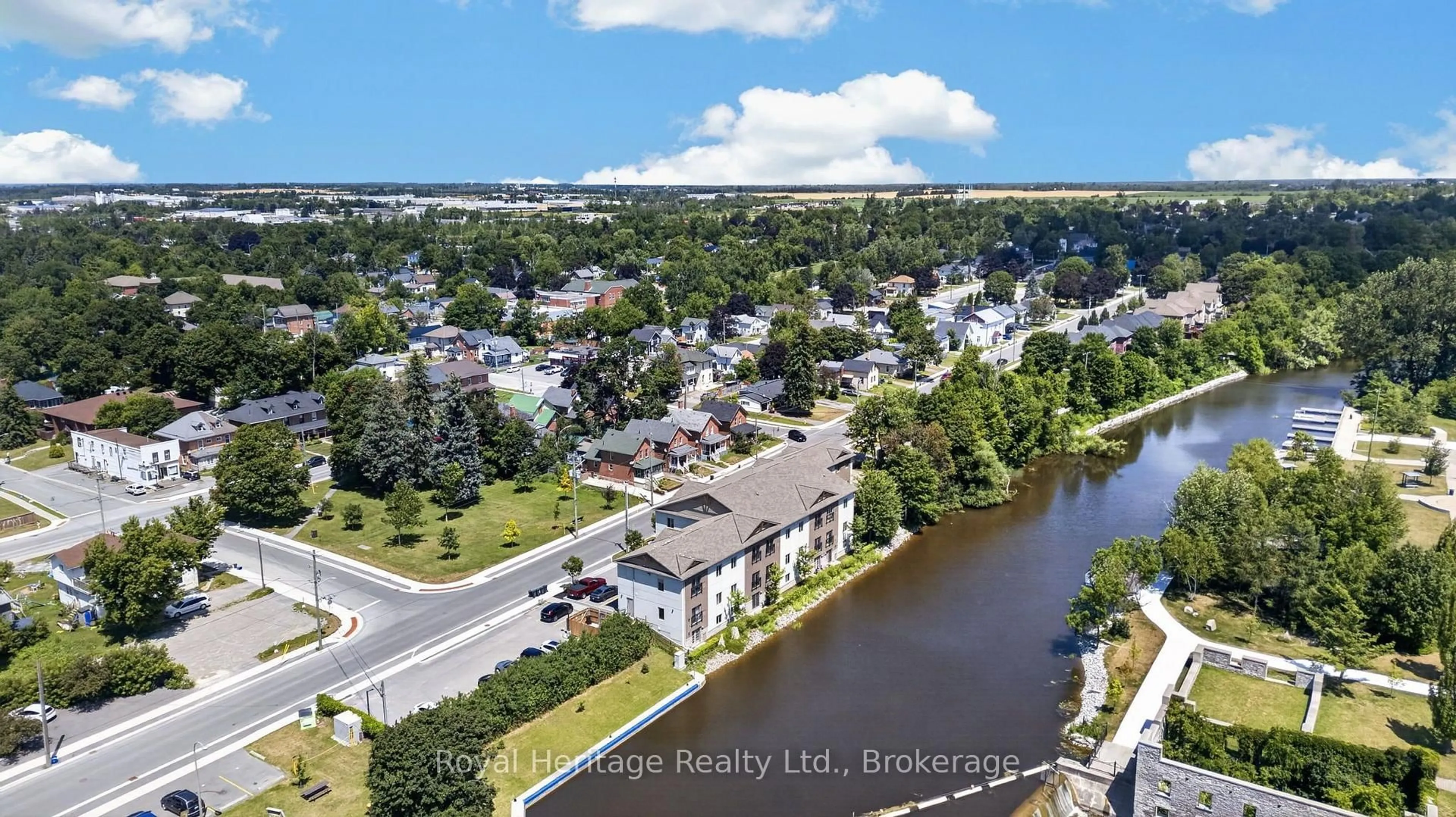 A pic from outside/outdoor area/front of a property/back of a property/a pic from drone, water/lake/river/ocean view for 25 King St #204, Kawartha Lakes Ontario K9V 1C4