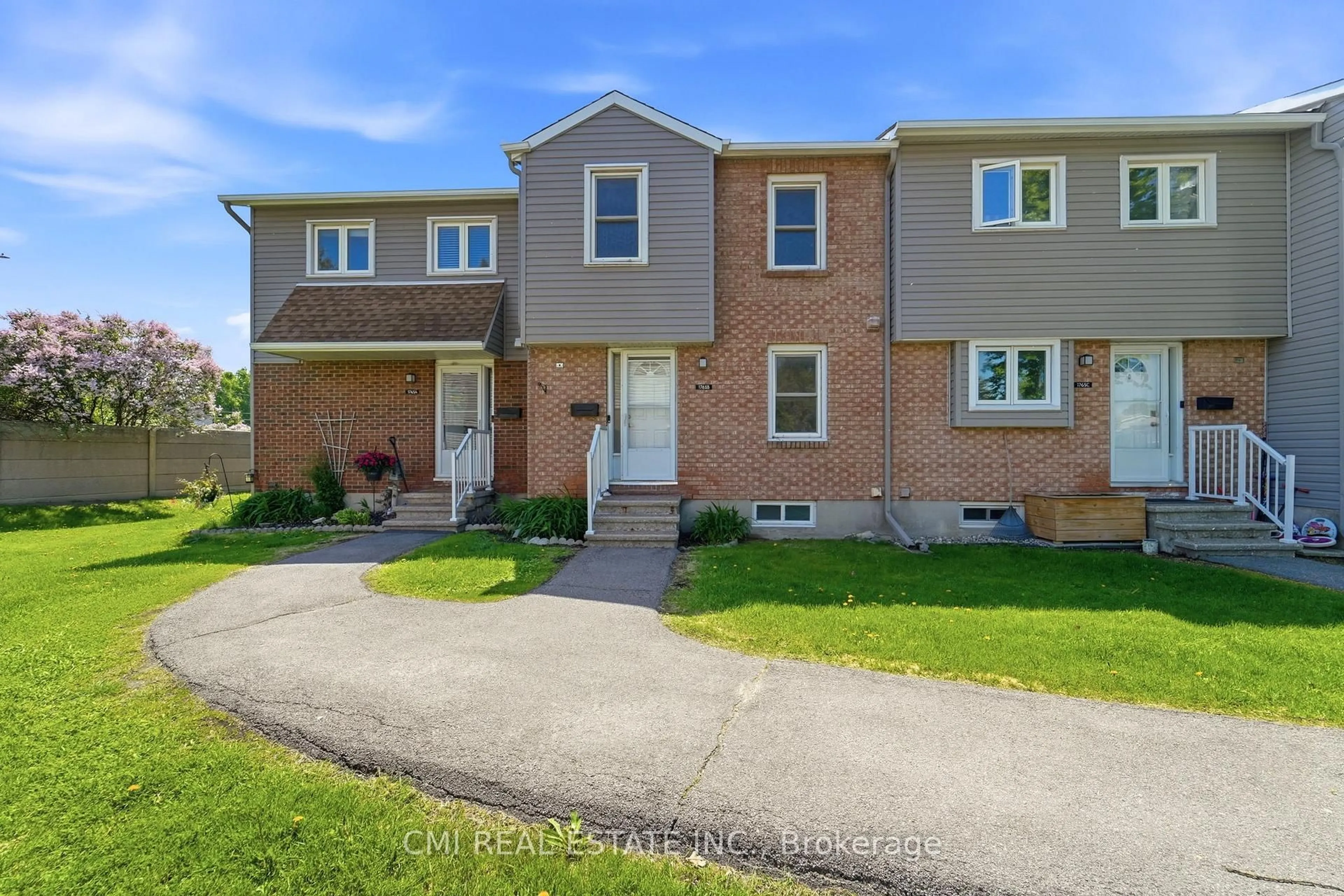 Home with brick exterior material, street for 1765 Lamoureux Dr #B, Ottawa Ontario K1E 2N5