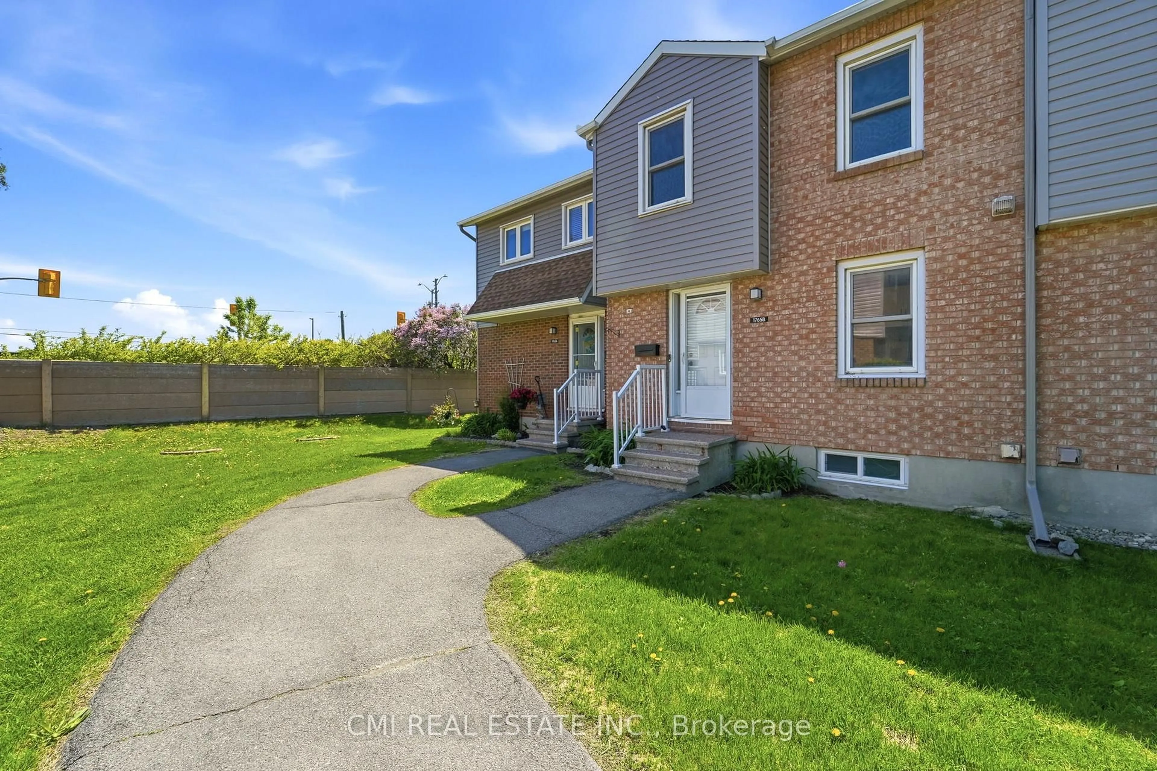 A pic from outside/outdoor area/front of a property/back of a property/a pic from drone, street for 1765 Lamoureux Dr #B, Ottawa Ontario K1E 2N5
