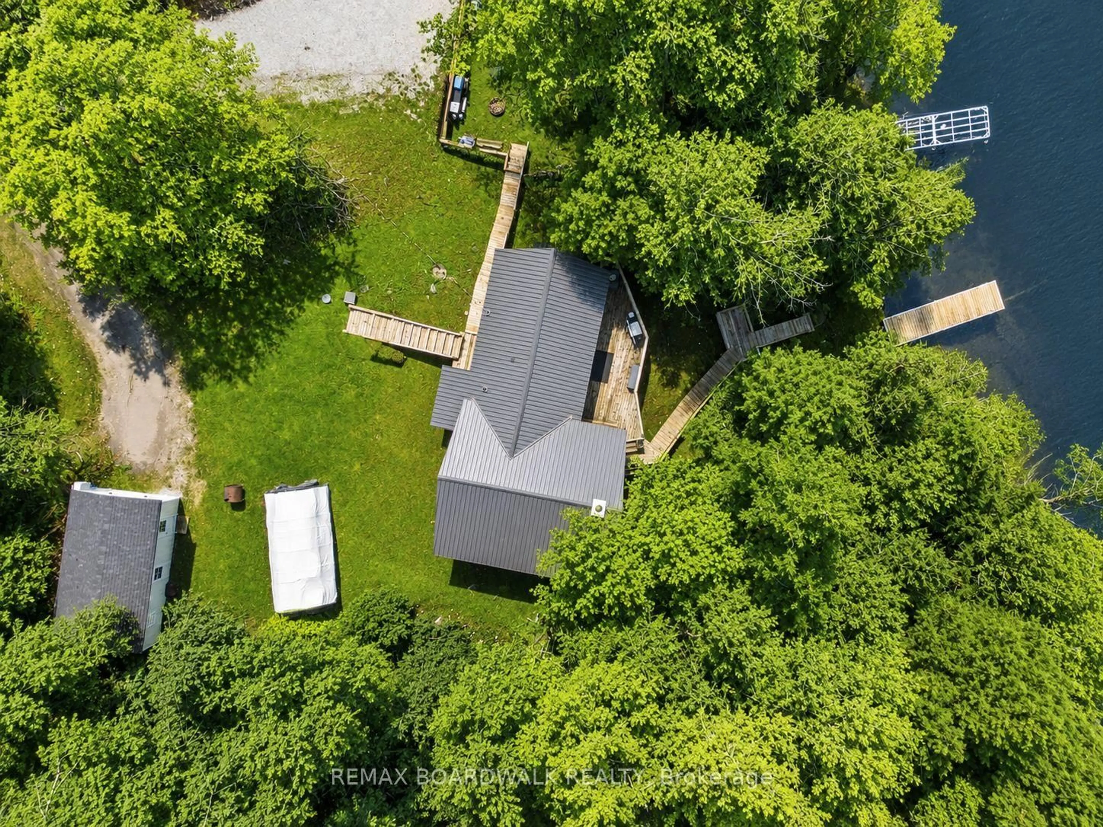 A pic from outside/outdoor area/front of a property/back of a property/a pic from drone, unknown for 1091 Big Clear Lane, Frontenac Ontario K0H 0B6