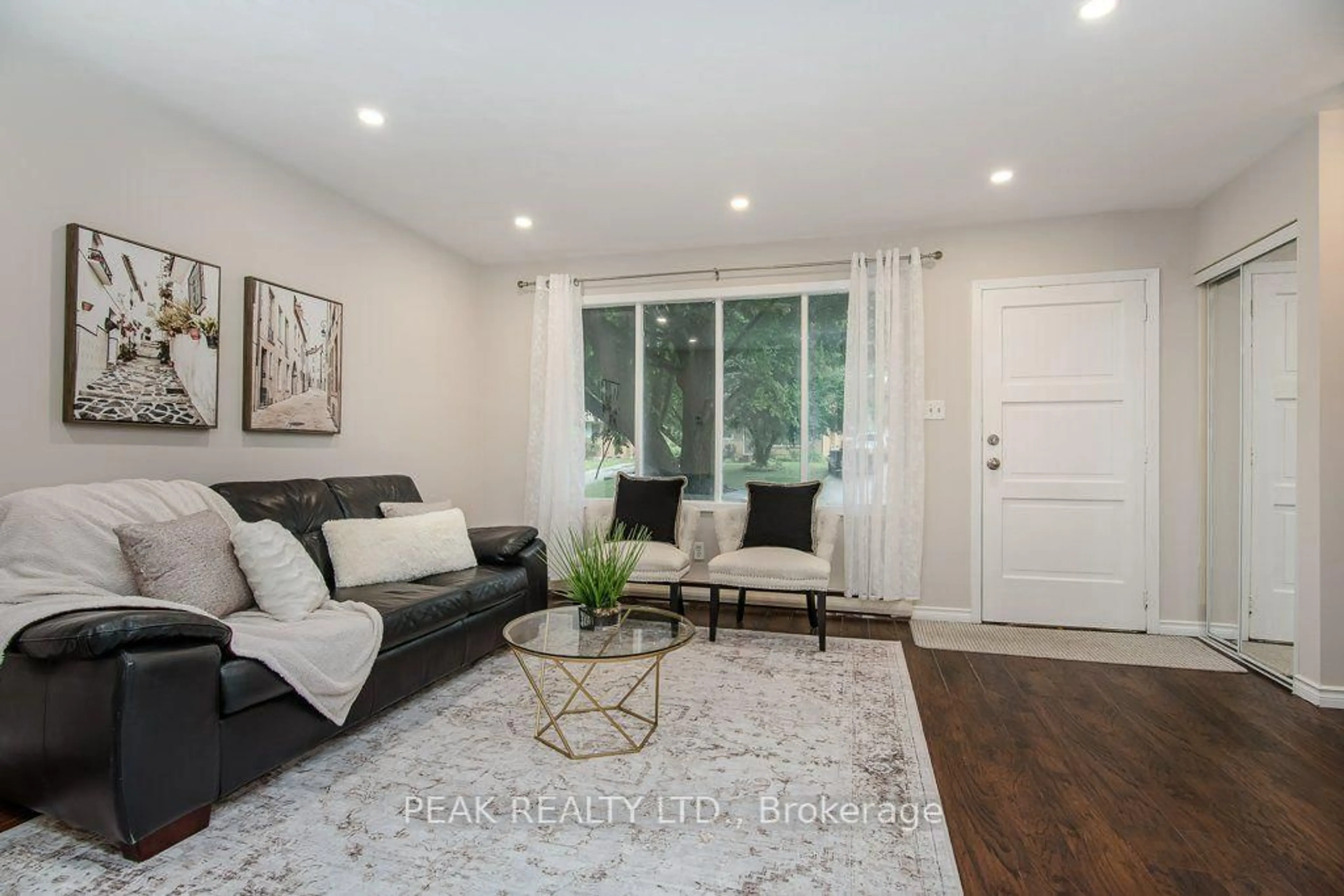 Living room with furniture, wood/laminate floor for 185 Cedarvale Cres #A, Waterloo Ontario N2L 4T3