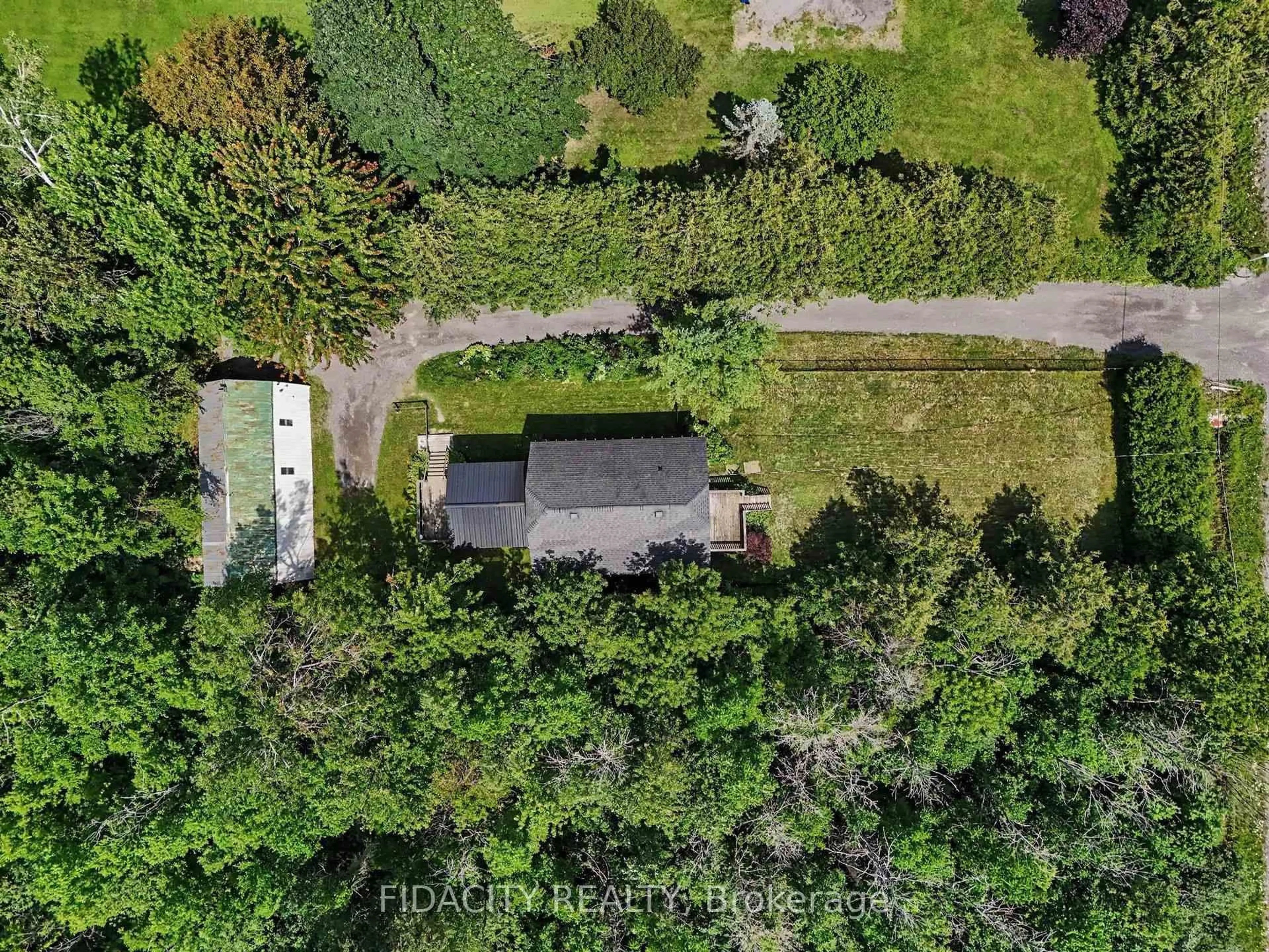 A pic from outside/outdoor area/front of a property/back of a property/a pic from drone, forest/trees view for 6811 Flewellyn Rd, Ottawa Ontario K2S 1B6