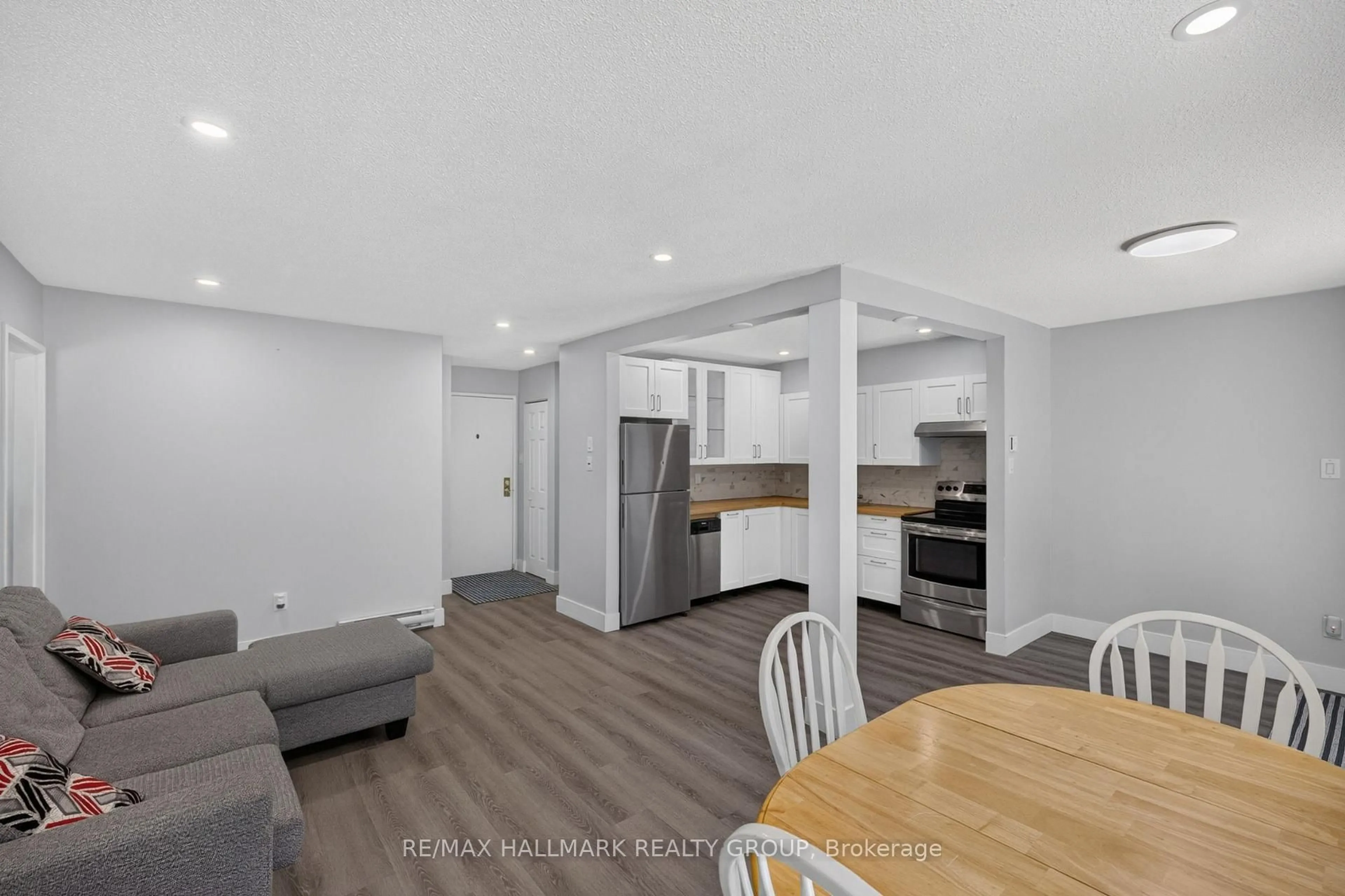 Open concept kitchen, wood/laminate floor for 2080 Ogilvie Rd #9J, Ottawa Ontario K1J 7N8