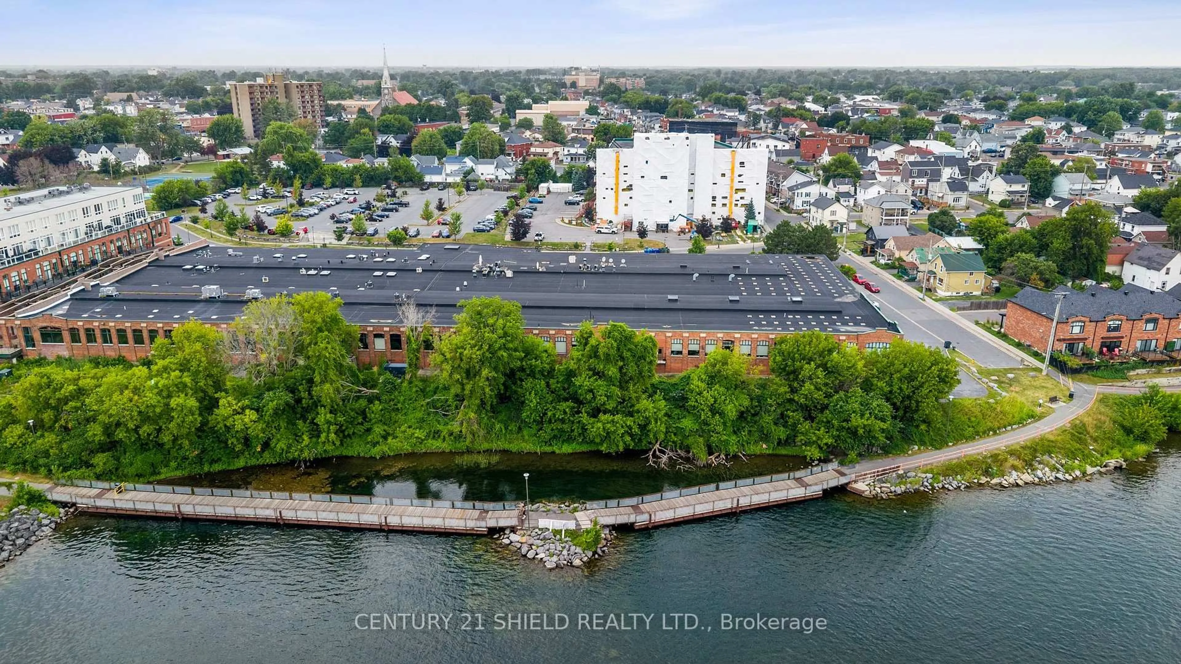 A pic from outside/outdoor area/front of a property/back of a property/a pic from drone, unknown for 710 Cotton Mill St #502, Cornwall Ontario K6H 7L3