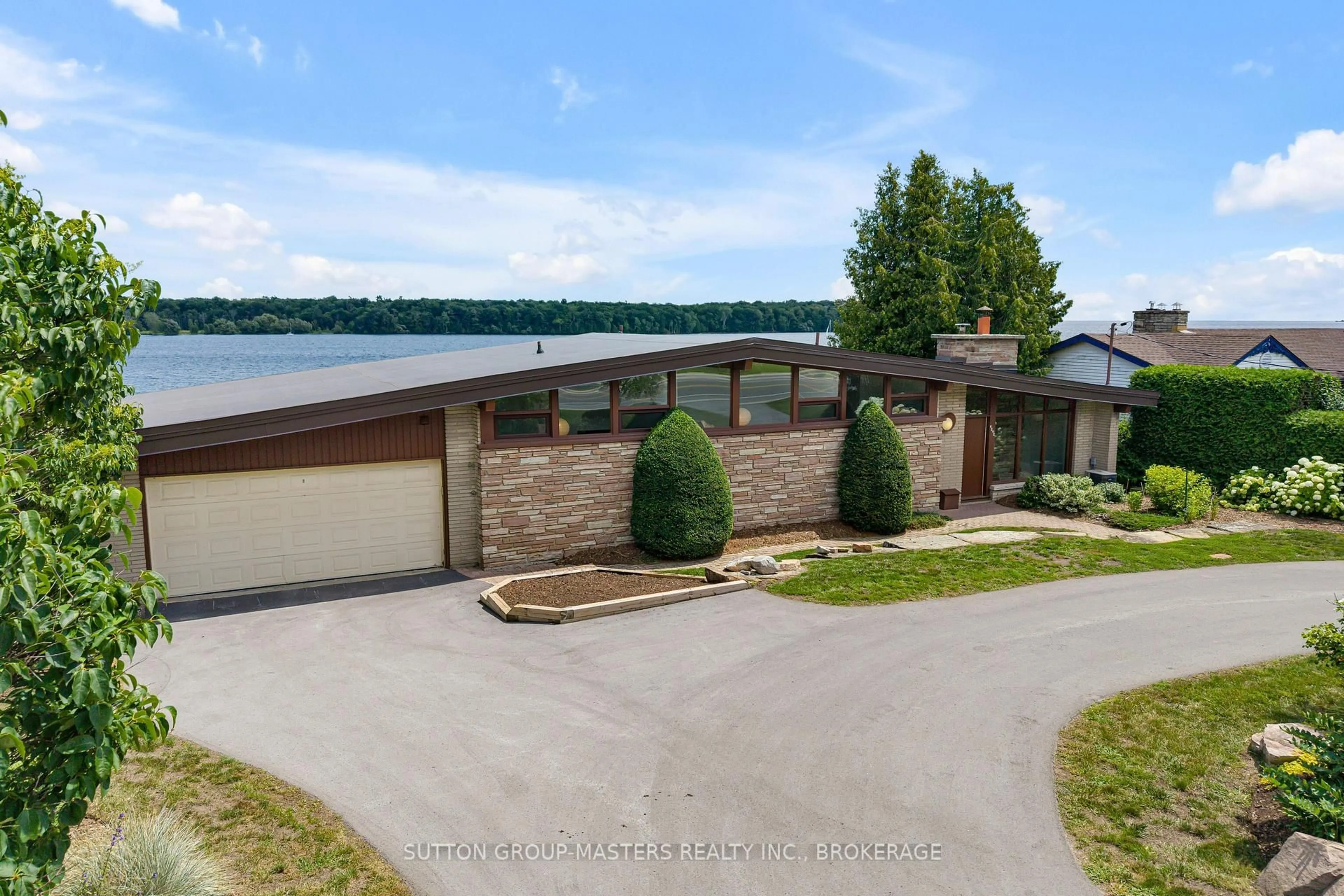 A pic from outside/outdoor area/front of a property/back of a property/a pic from drone, water/lake/river/ocean view for 4242 Bath Rd, Kingston Ontario K7M 4Y7