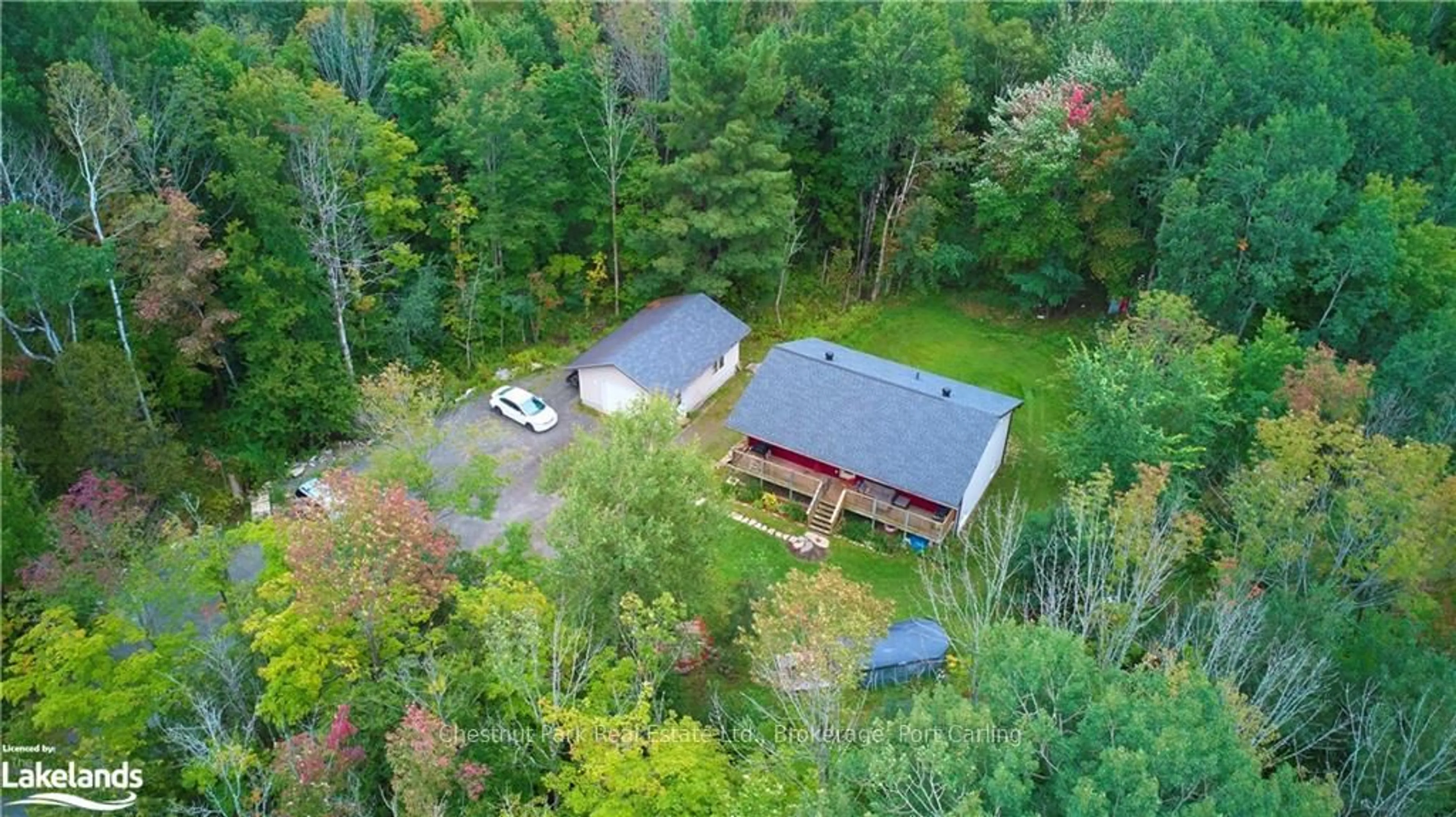 A pic from outside/outdoor area/front of a property/back of a property/a pic from drone, forest/trees view for 295 TOWN LINE Rd, Huntsville Ontario P1H 1T8