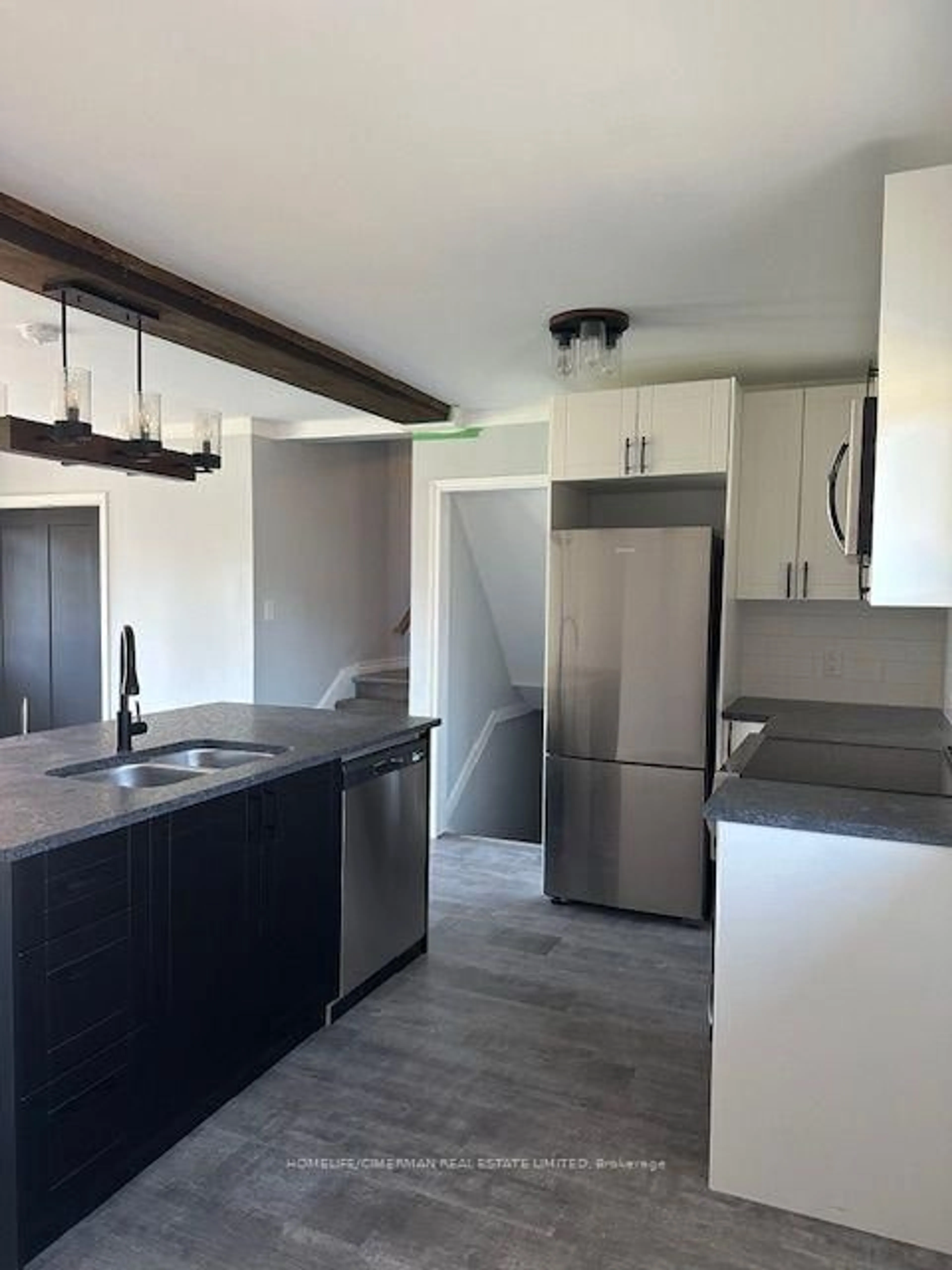 Open concept kitchen, wood/laminate floor for 1210 Homuth Ave, Cambridge Ontario N3H 2C9