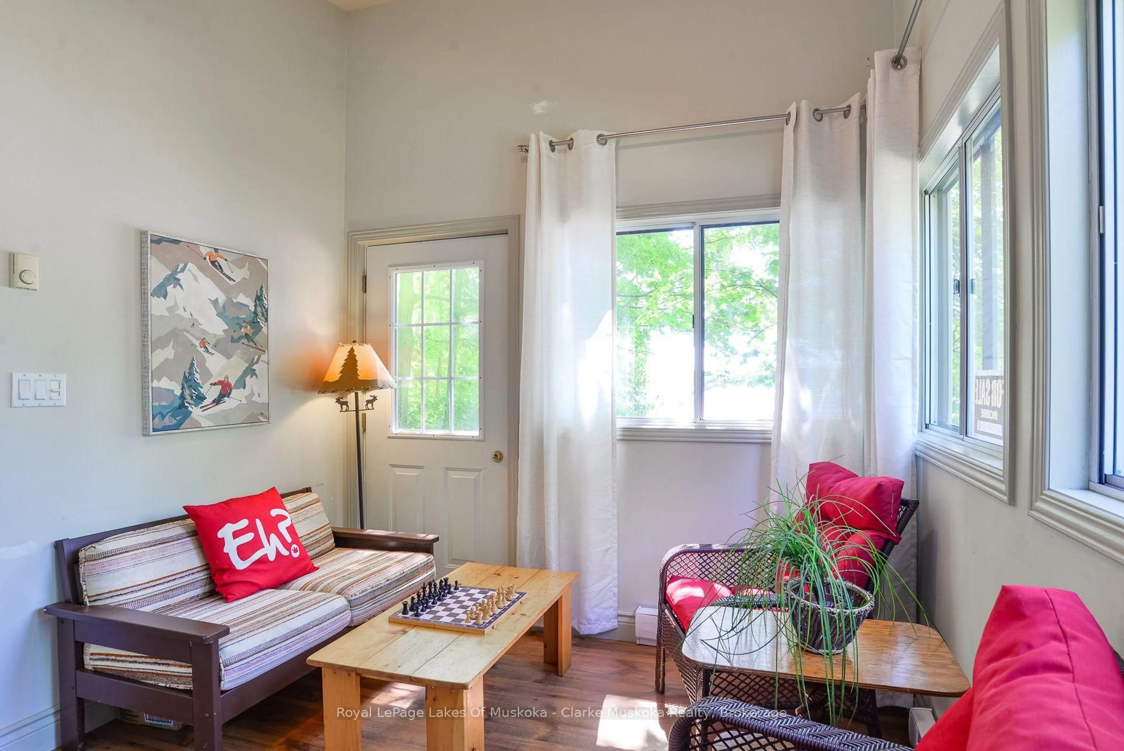 Living room with furniture, wood/laminate floor for 7 Silver Point Rd #8, Seguin Ontario P2A 2W8