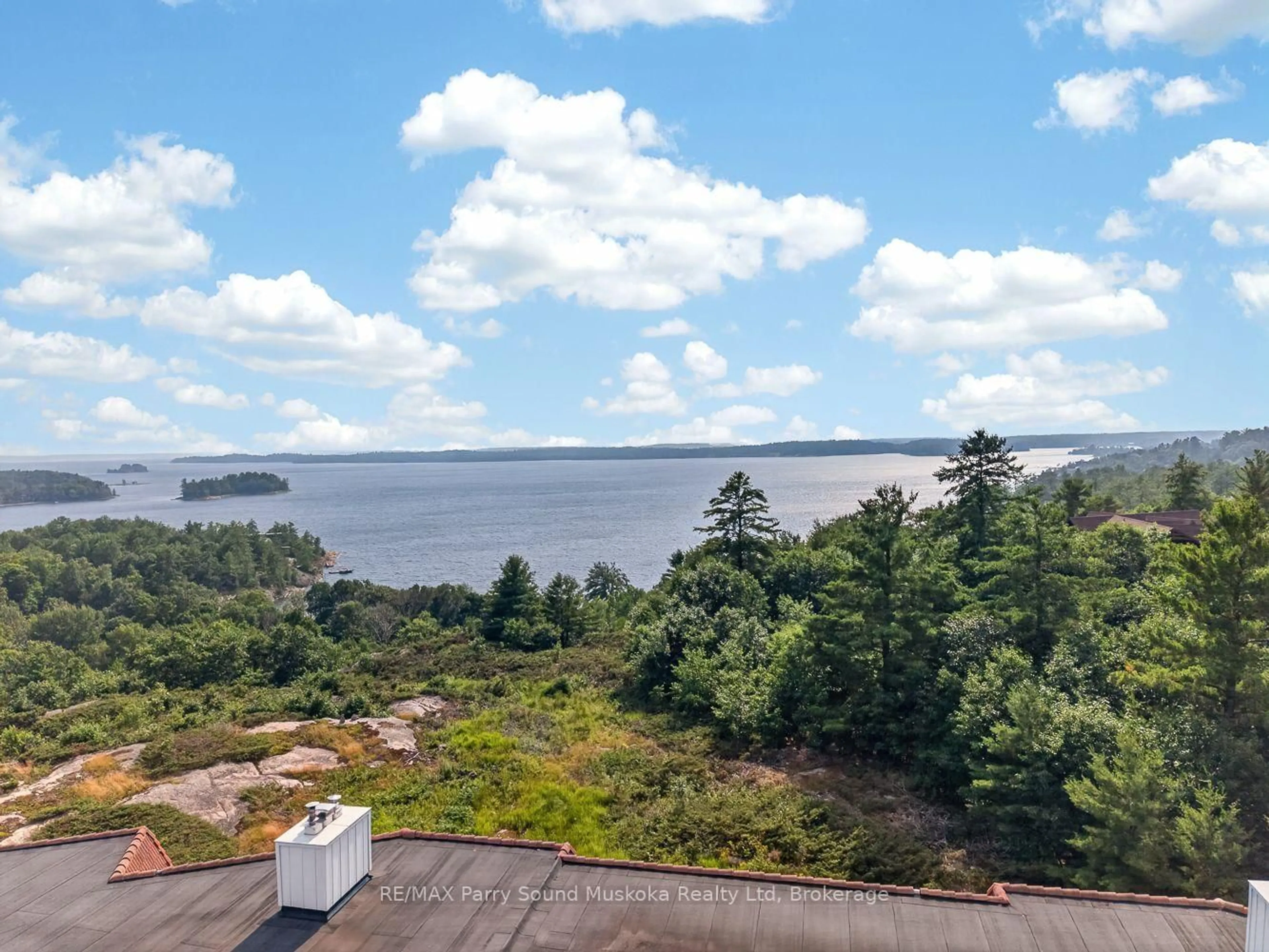 A pic from outside/outdoor area/front of a property/back of a property/a pic from drone, water/lake/river/ocean view for 20 RYDER Dr #3E, McDougall Ontario P2A 2W9