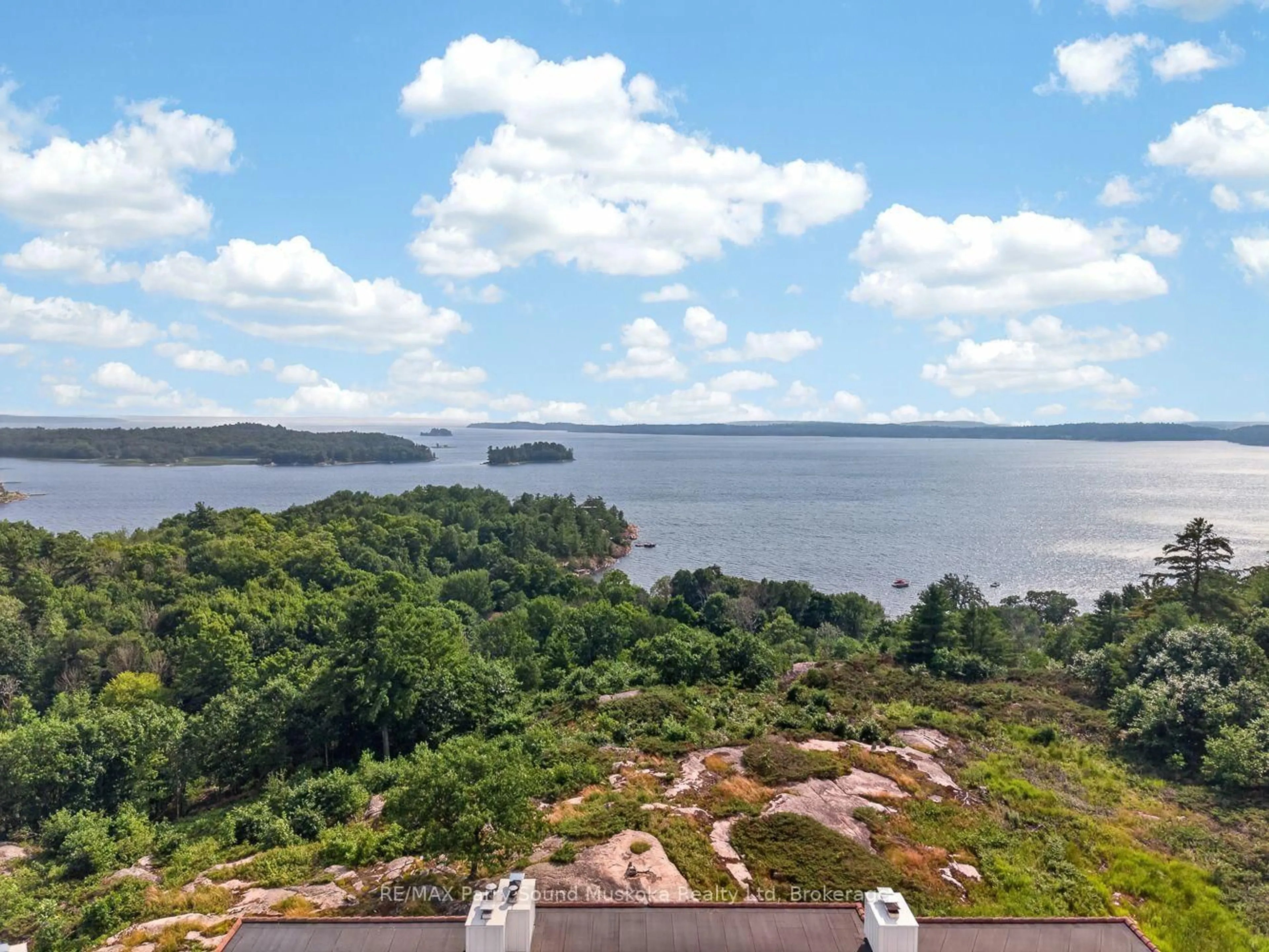 A pic from outside/outdoor area/front of a property/back of a property/a pic from drone, water/lake/river/ocean view for 20 RYDER Dr #3E, McDougall Ontario P2A 2W9