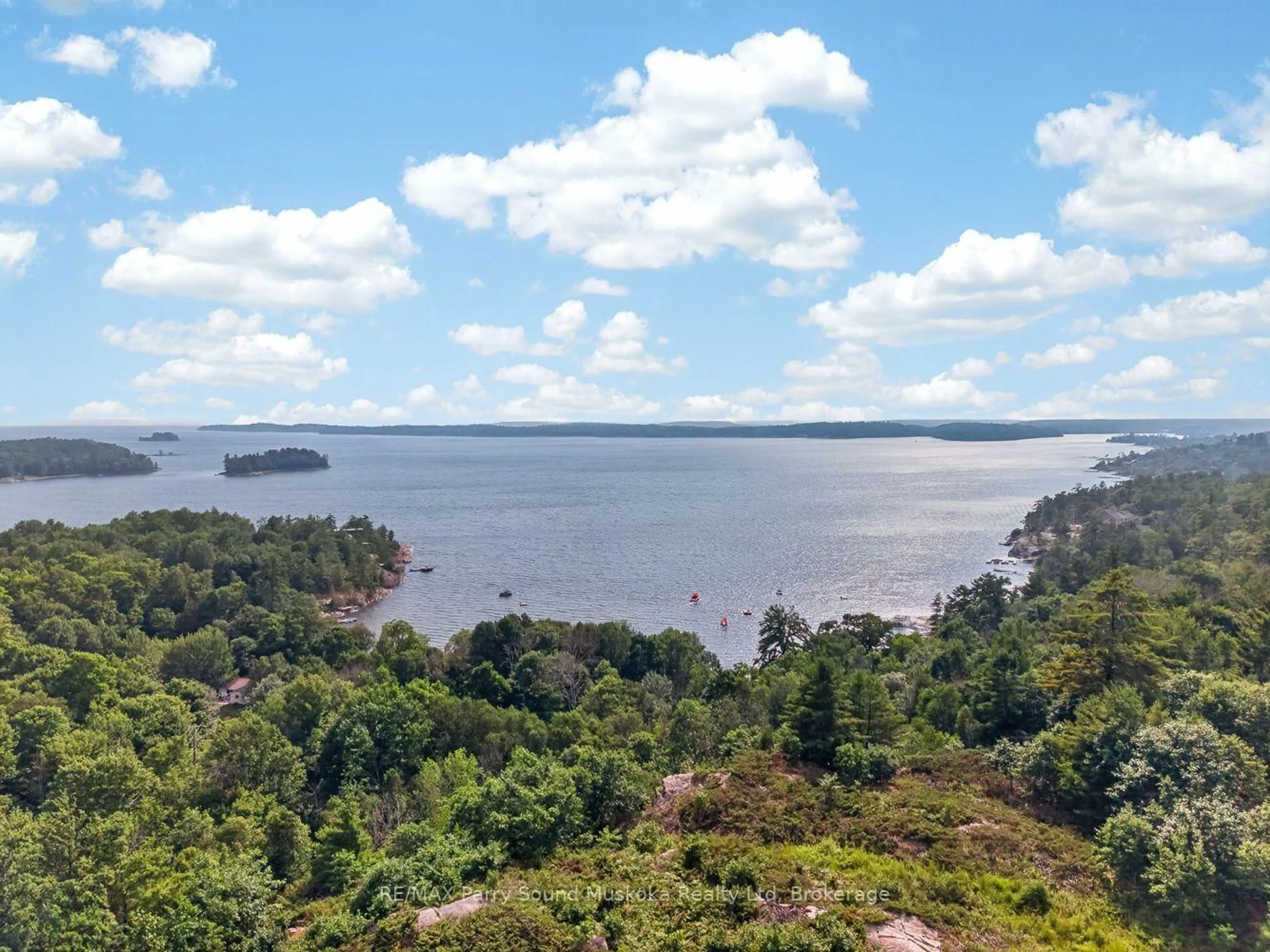 A pic from outside/outdoor area/front of a property/back of a property/a pic from drone, water/lake/river/ocean view for 20 RYDER Dr #3E, McDougall Ontario P2A 2W9