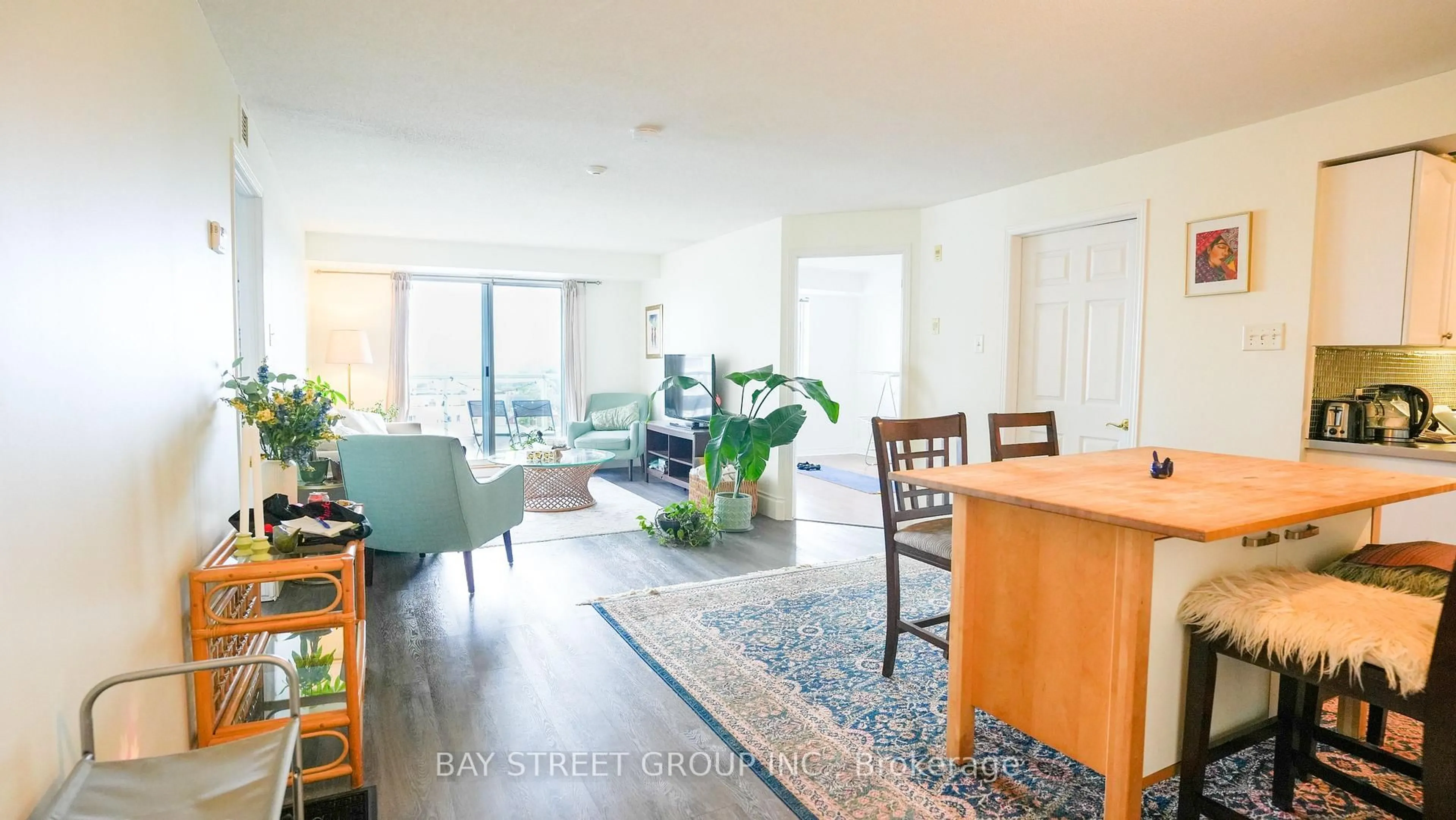 Living room with furniture, wood/laminate floor for 429 Somerset St #1007, Ottawa Ontario K2P 2P5